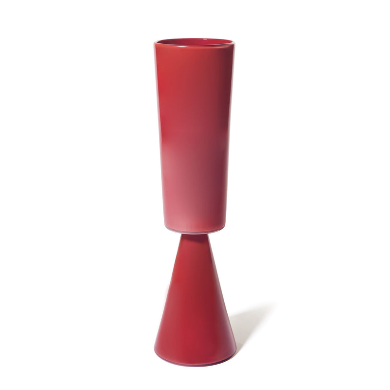 The Fiorelli Tall Cylinder is a modern vase in sienna, featuring a glossy finish with a tall cylindrical top and a cone-shaped base, displayed against a plain white background.