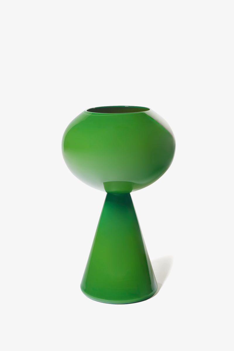 Introducing the Fiorelli Concave—a glossy green vase featuring a wide, rounded top and a conical base, showcased against a plain white background.