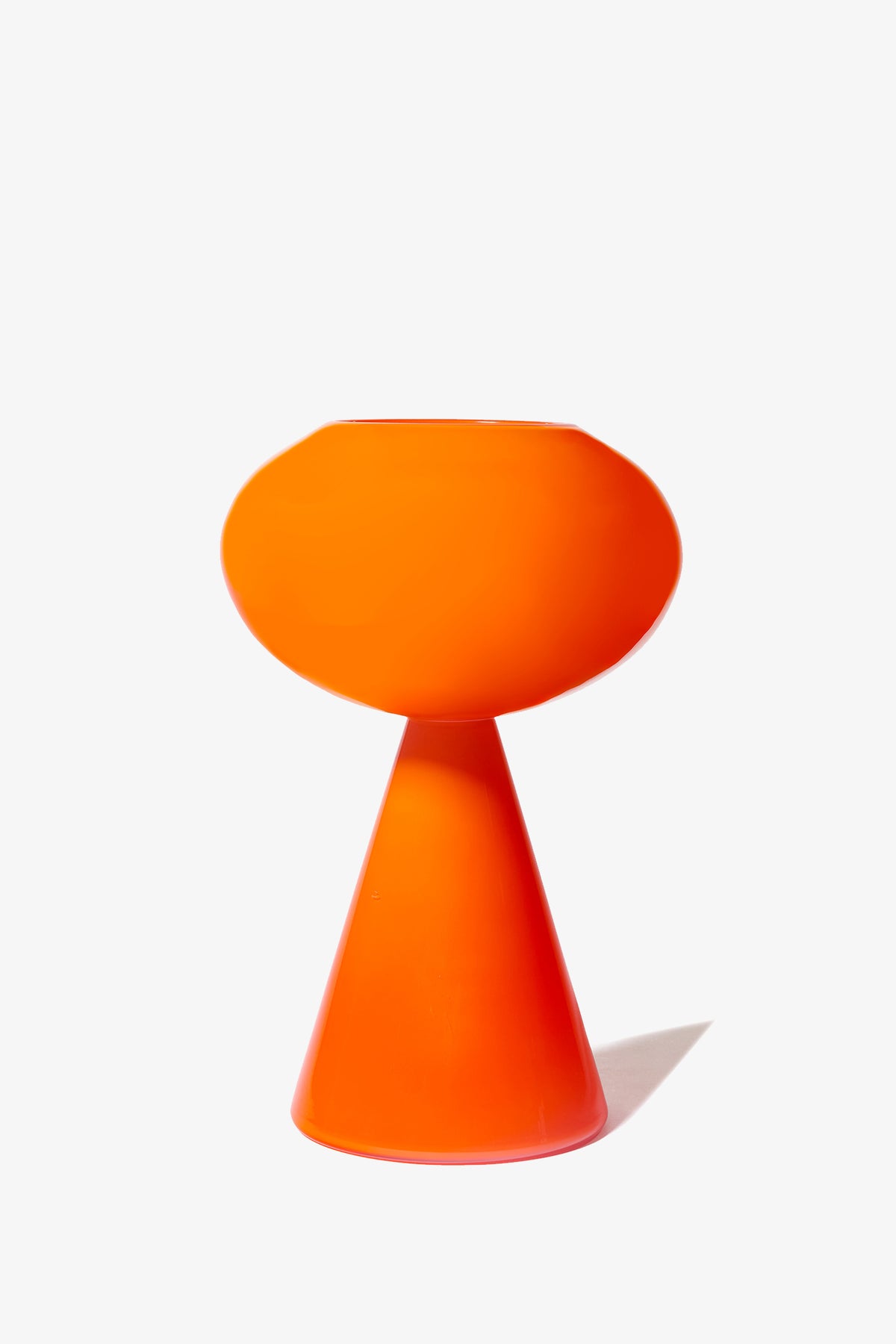 A contemporary Fiorelli Concave orange vase featuring a round top and cone-shaped base, displayed against a plain white background.