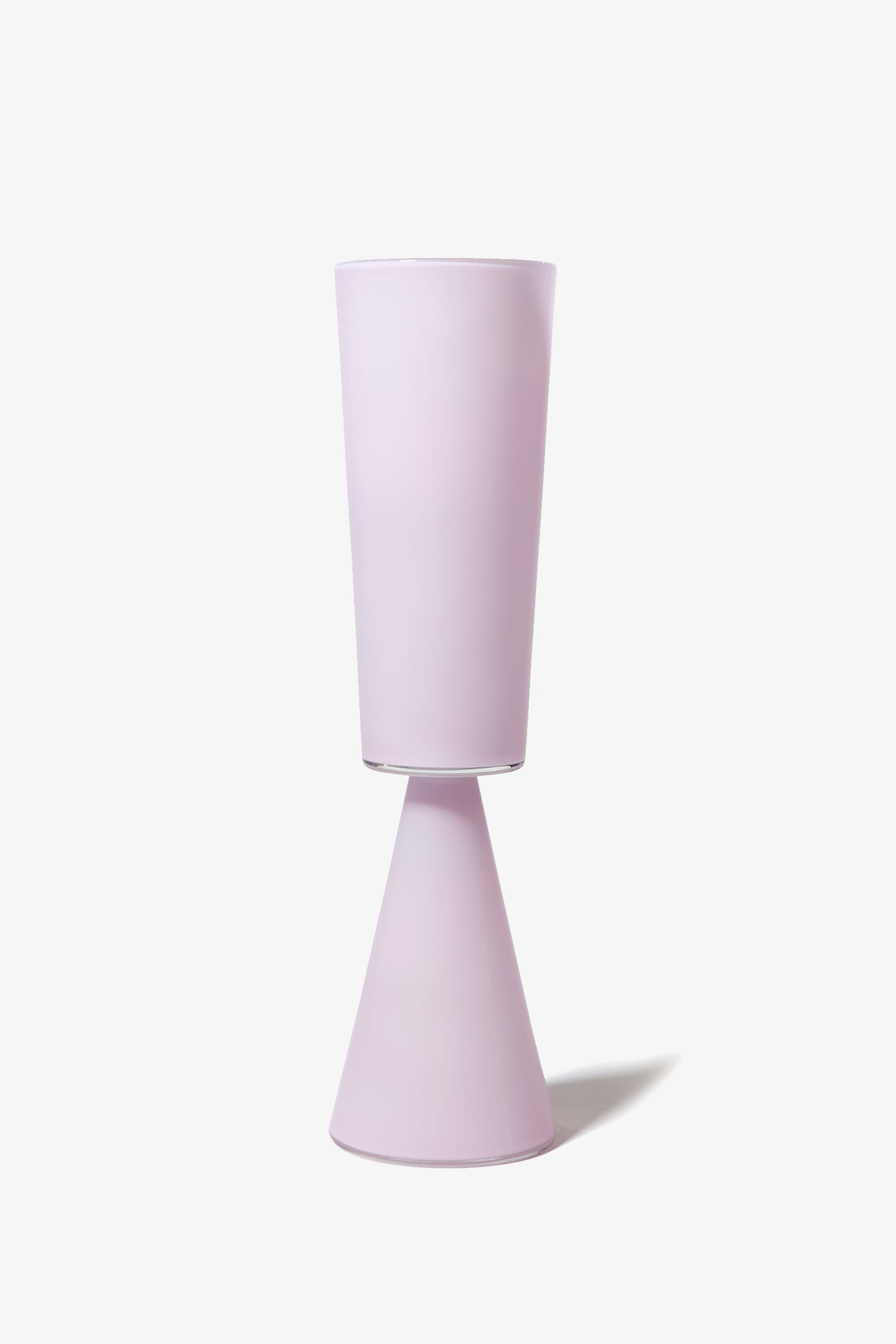 A modern Fiorelli Tall Cylinder glass in light purple, featuring a tall cup and cone-shaped base, set against a white background.