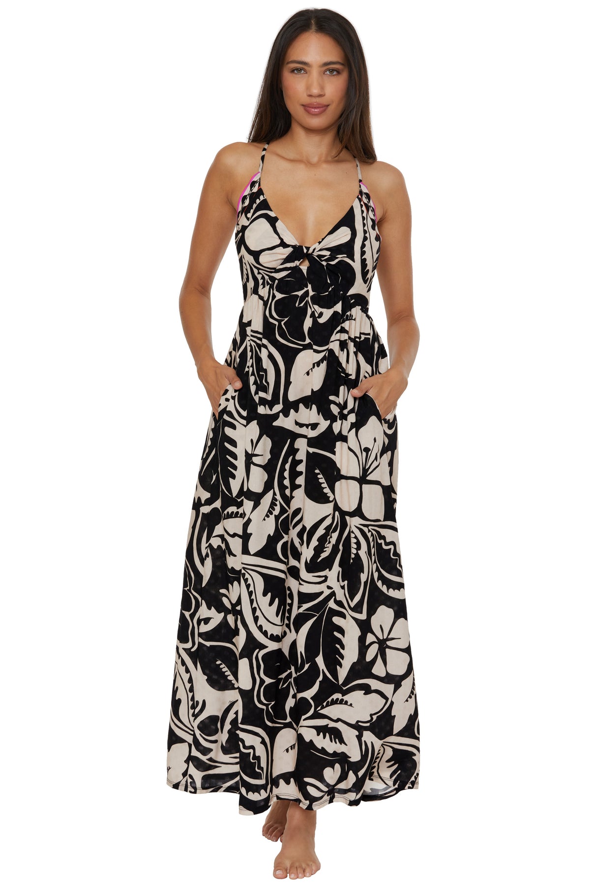 Woman wearing the Twist Back Maxi Dress Cover-Up in Florence Swim, a sleeveless, floor-length dress with pockets, standing barefoot and facing forward against a plain white background.