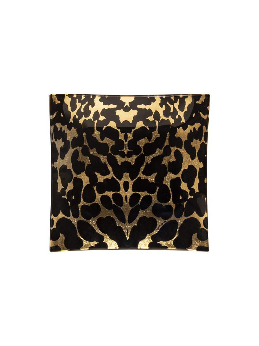 The Ortigia Gattopardo Glass Plate features a square shape with a LEOPARD black and gold abstract animal print design, shown on a plain white background.