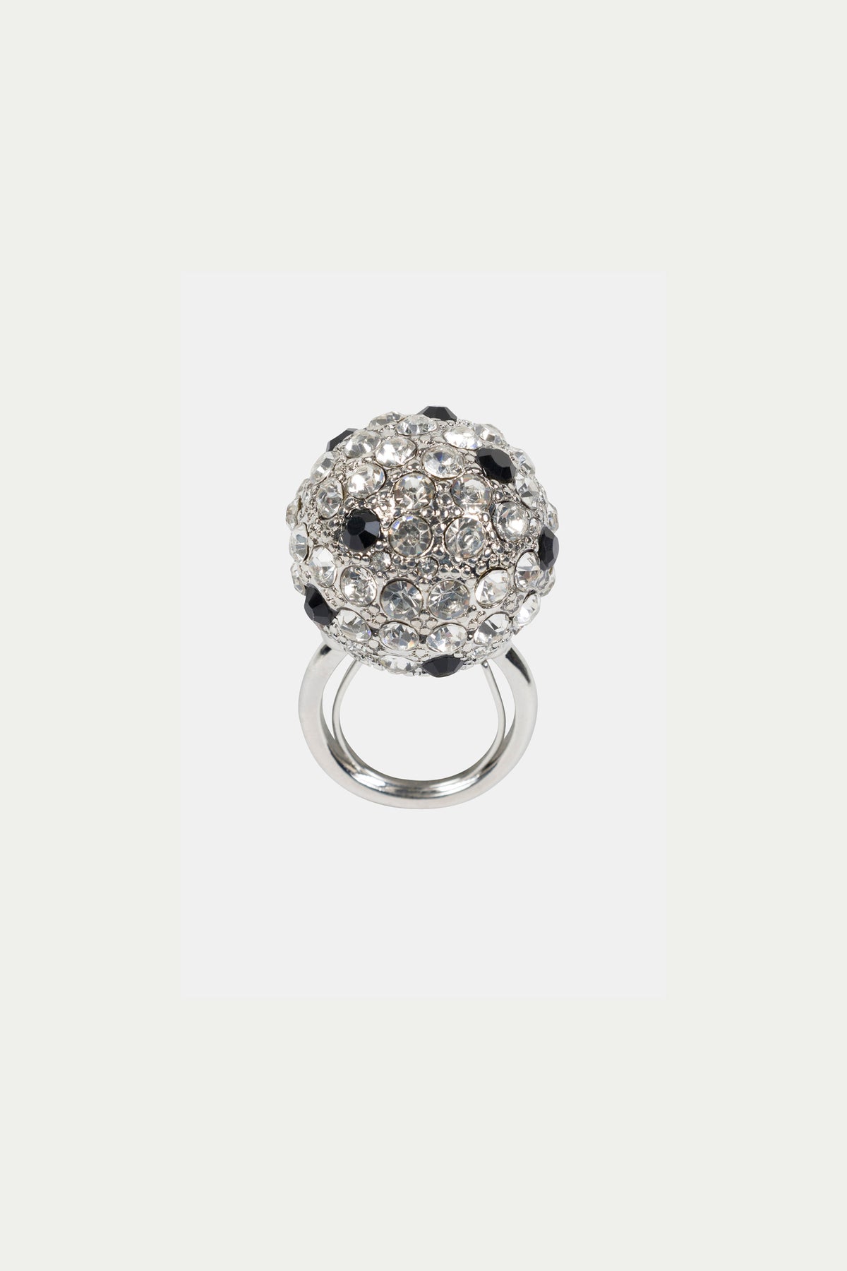 The Cryjet Disco Ball Adjustable Ring is a silver ring with a large, round cluster design featuring sparkling clear and black gemstones on top.
