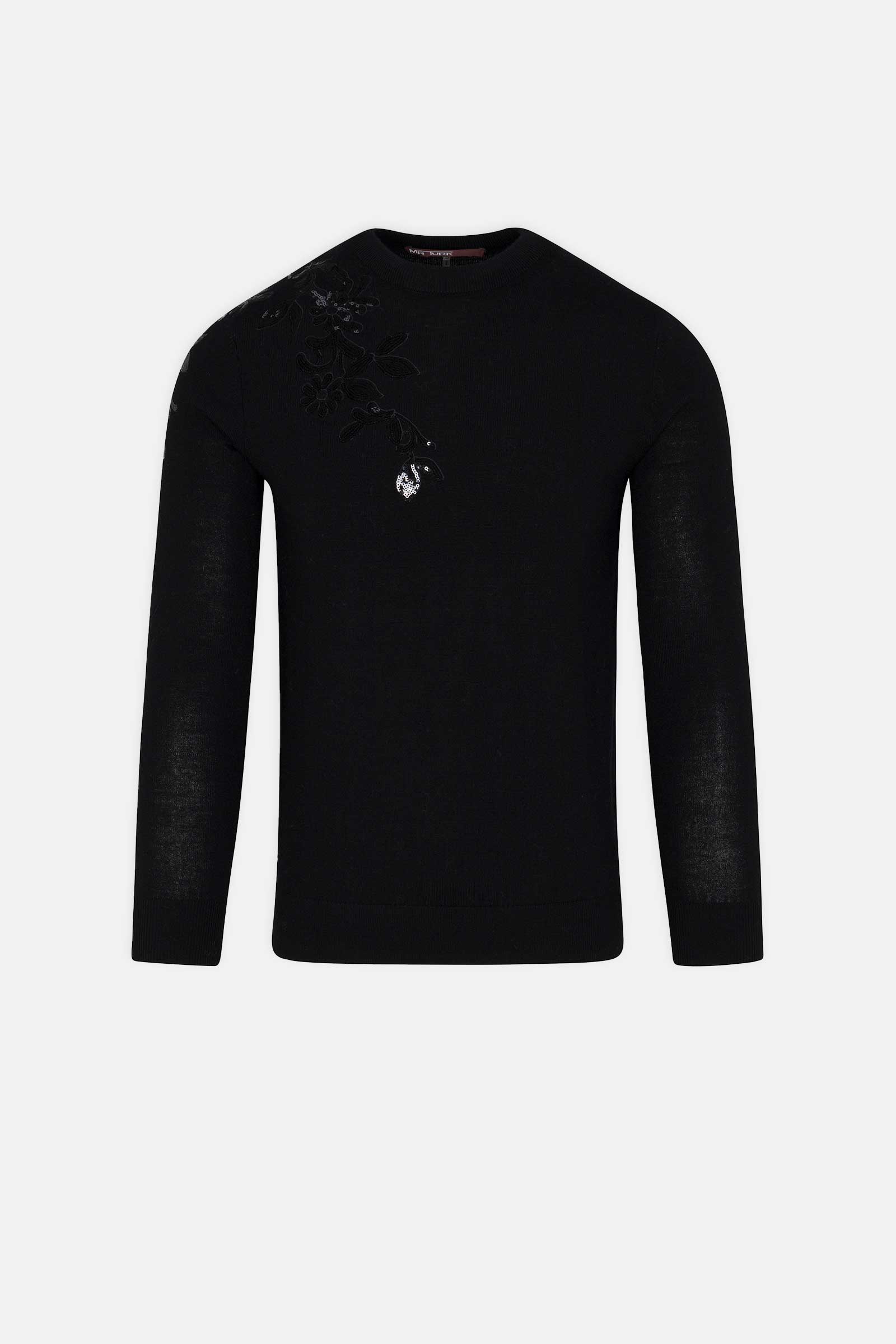 The Jaxon Sequin Crewneck Sweater is a black, long-sleeve crewneck with subtle floral embroidery on the left shoulder, shown against a plain white background.