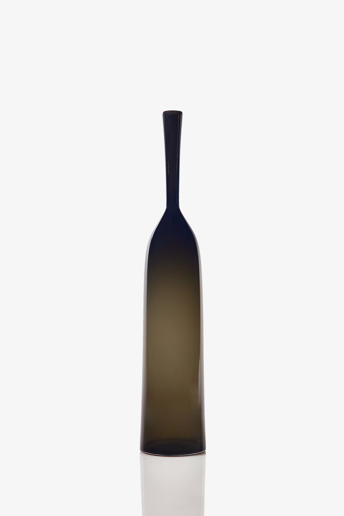 A Large Angelic Bottle, featuring a tall, dark translucent glass body with a narrow neck and a smooth, minimalist design, stands upright against a plain white background.