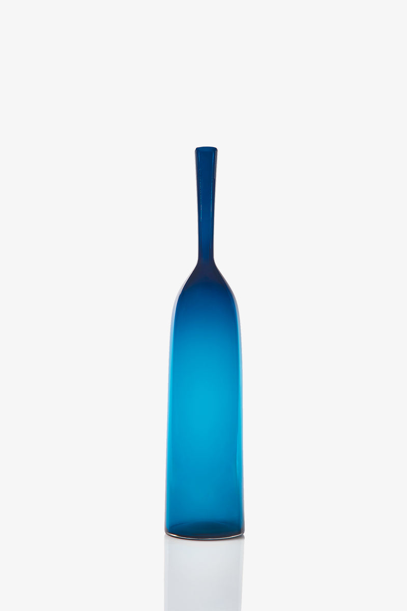 A Large Angelic Bottle, featuring a tall and slender blue glass design with a narrow neck, stands upright on a white background.
