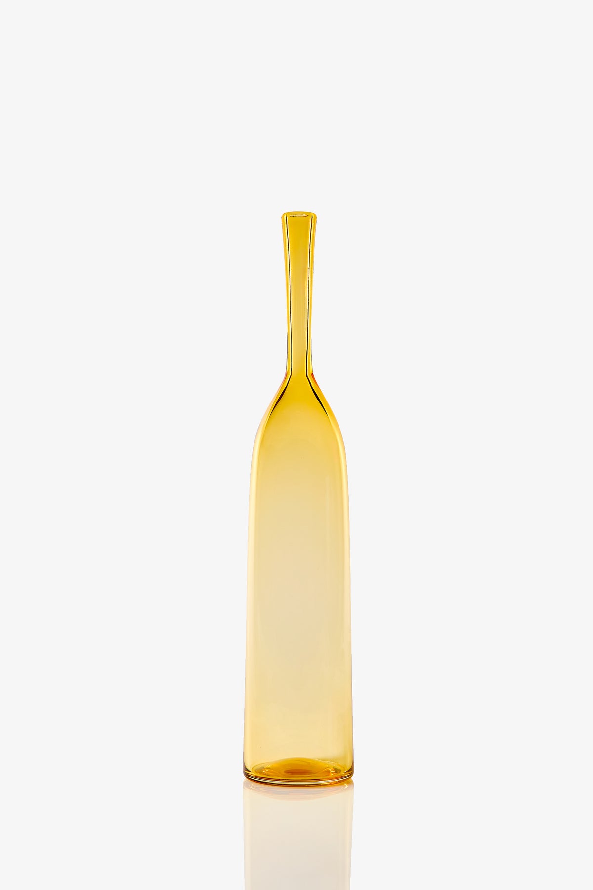 The Large Angelic Bottle stands upright on a reflective white background, featuring a tall, slender amber glass design with a narrow neck and smooth surface.