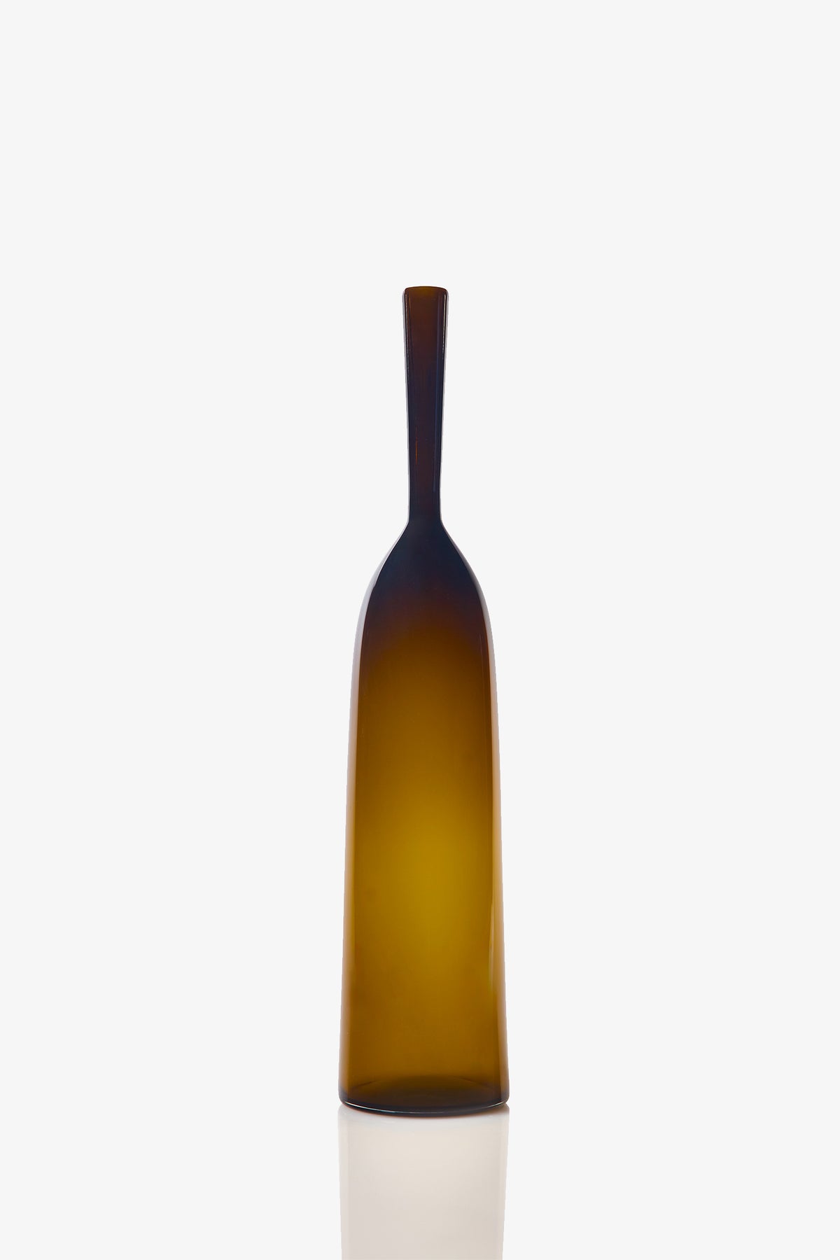 A Large Angelic Bottle, featuring a tall, narrow design with an amber-colored glass body, long neck, and flat base, is set against a plain white background.
