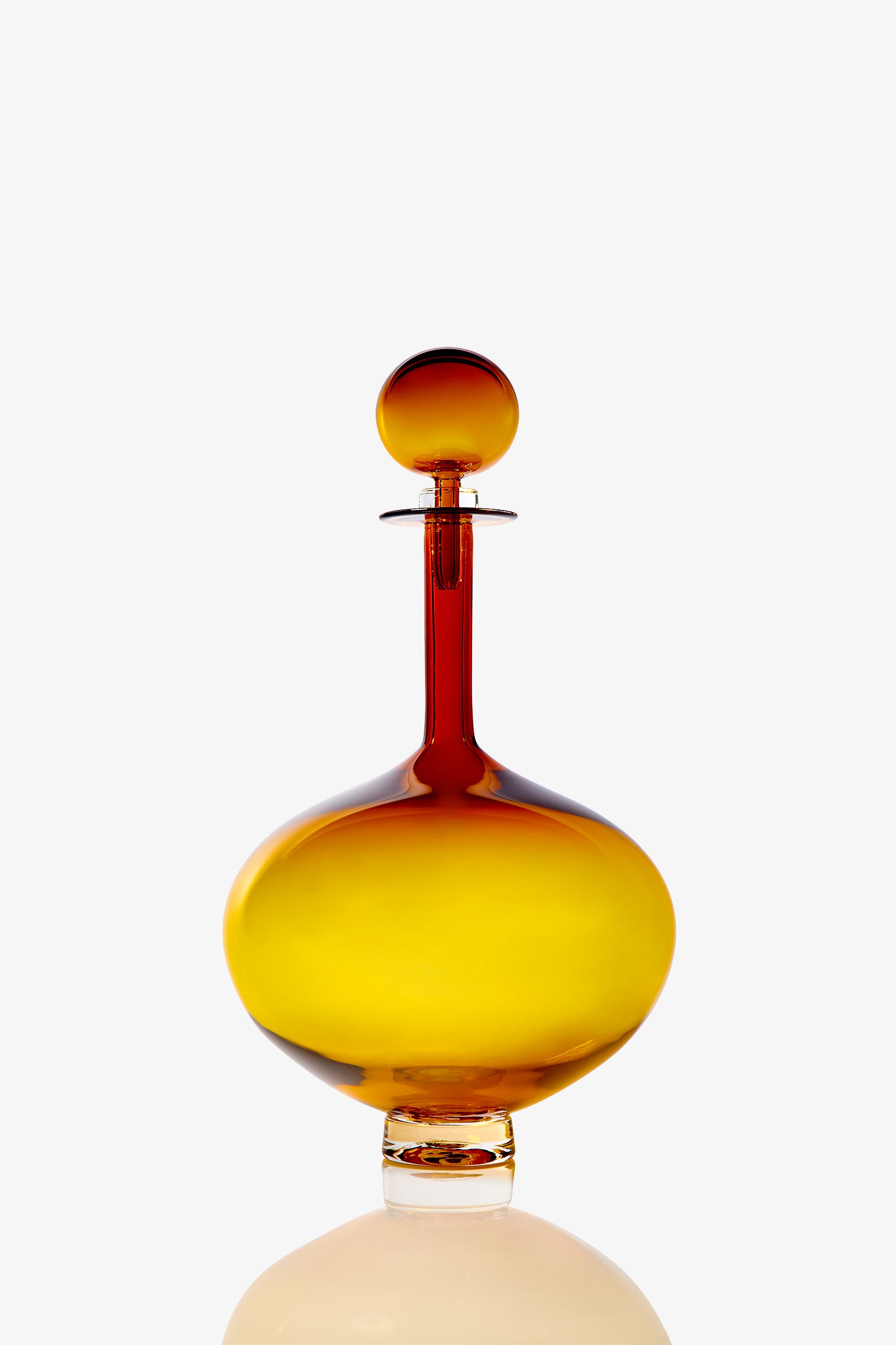 A Large Genie Bottle Decanter with a round stopper, featuring a yellow and amber gradient, set against a plain white background.