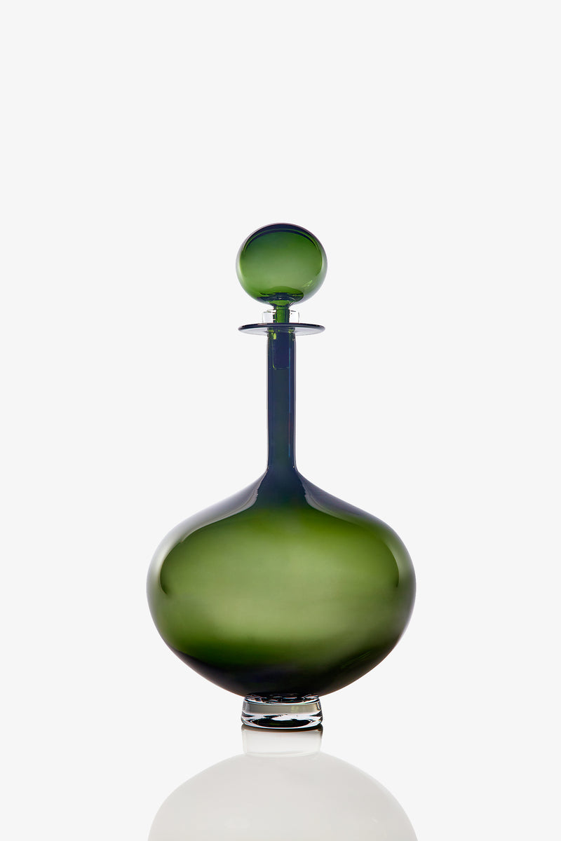 The Large Genie Bottle Decanter, featuring green glass with a round stopper, wide base, and narrow neck, is displayed against a white background.