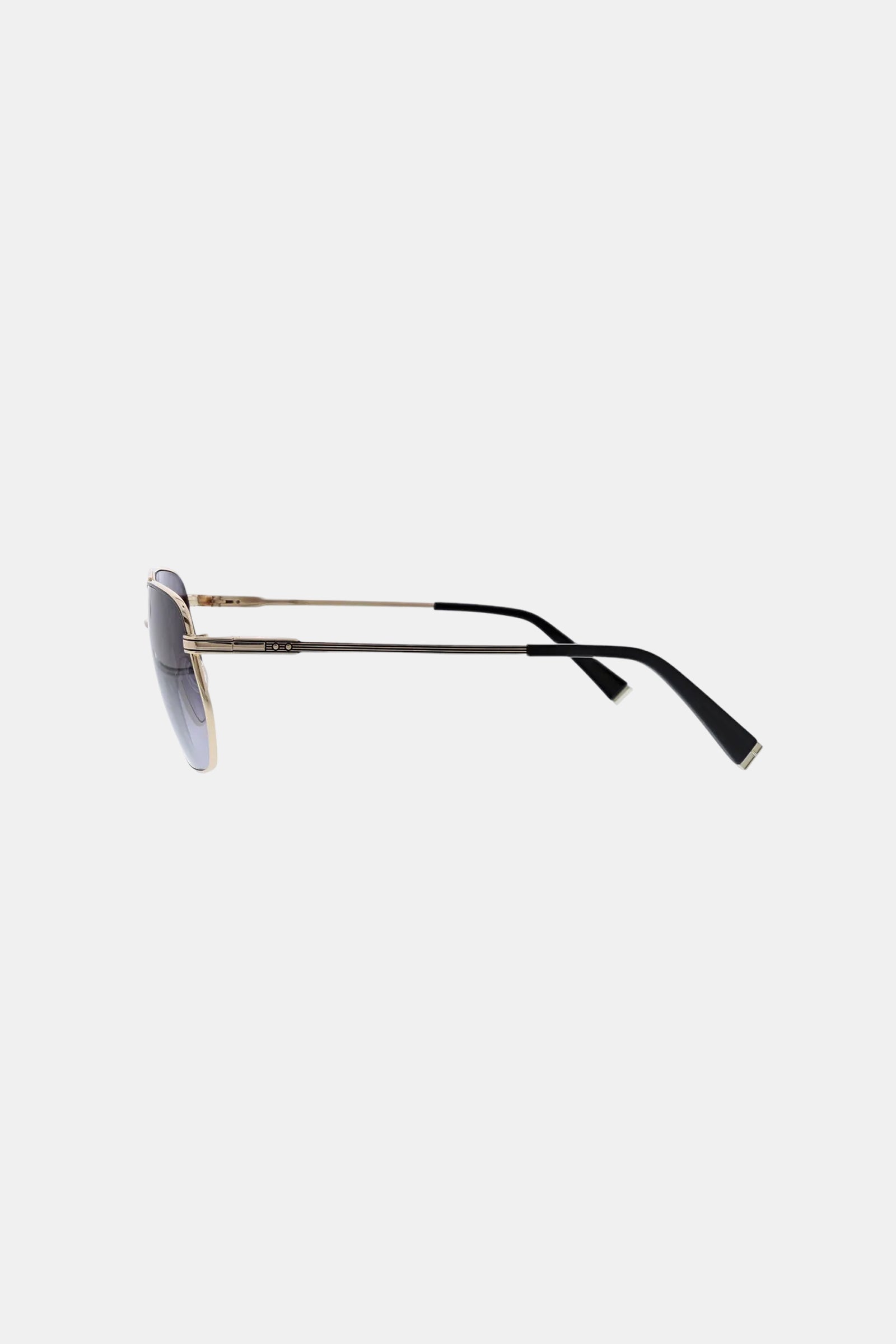 Side view of Le Chance Sunglass, featuring gold metal frames, black arms, and dark tinted lenses against a plain white background.