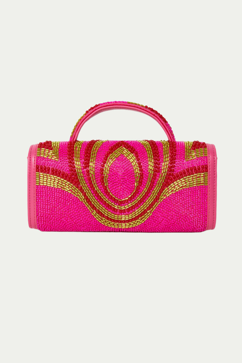 The Lele Sadoughi x Trina Turk Mini Tabitha Bead Bag is a small, cylindrical handbag in Pink Multi, featuring a top handle and intricate gold and red beadwork arranged in symmetrical circles on the front.