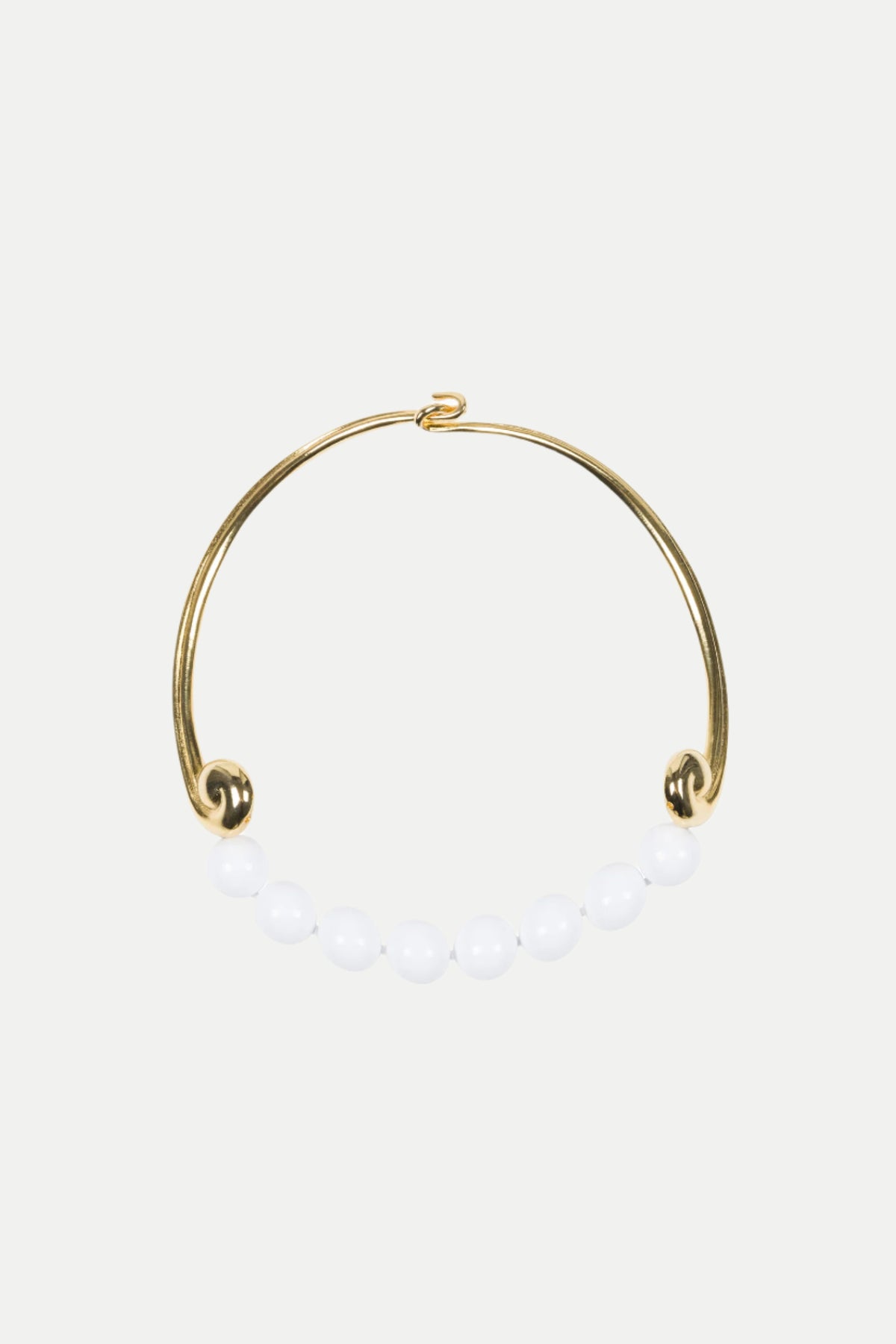 The KJL Beaded White and Gold Collar Necklace features a row of seven white round beads along the bottom, with an open hook clasp.
