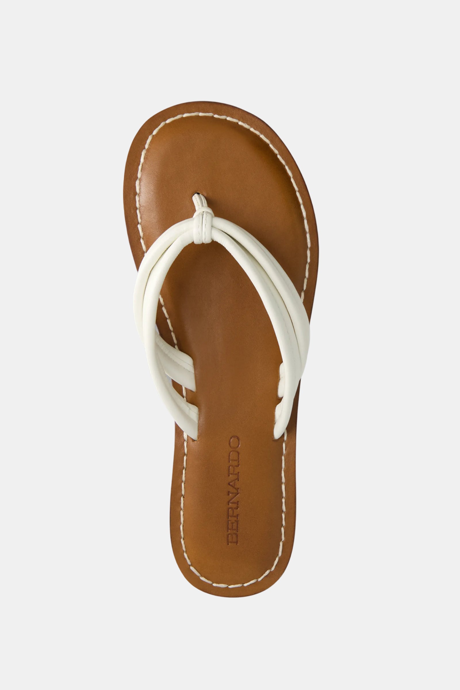 The Miami Sandal is a brown leather sandal with white double straps and white stitching around the sole, viewed from above. BERNARDO is embossed on the footbed.