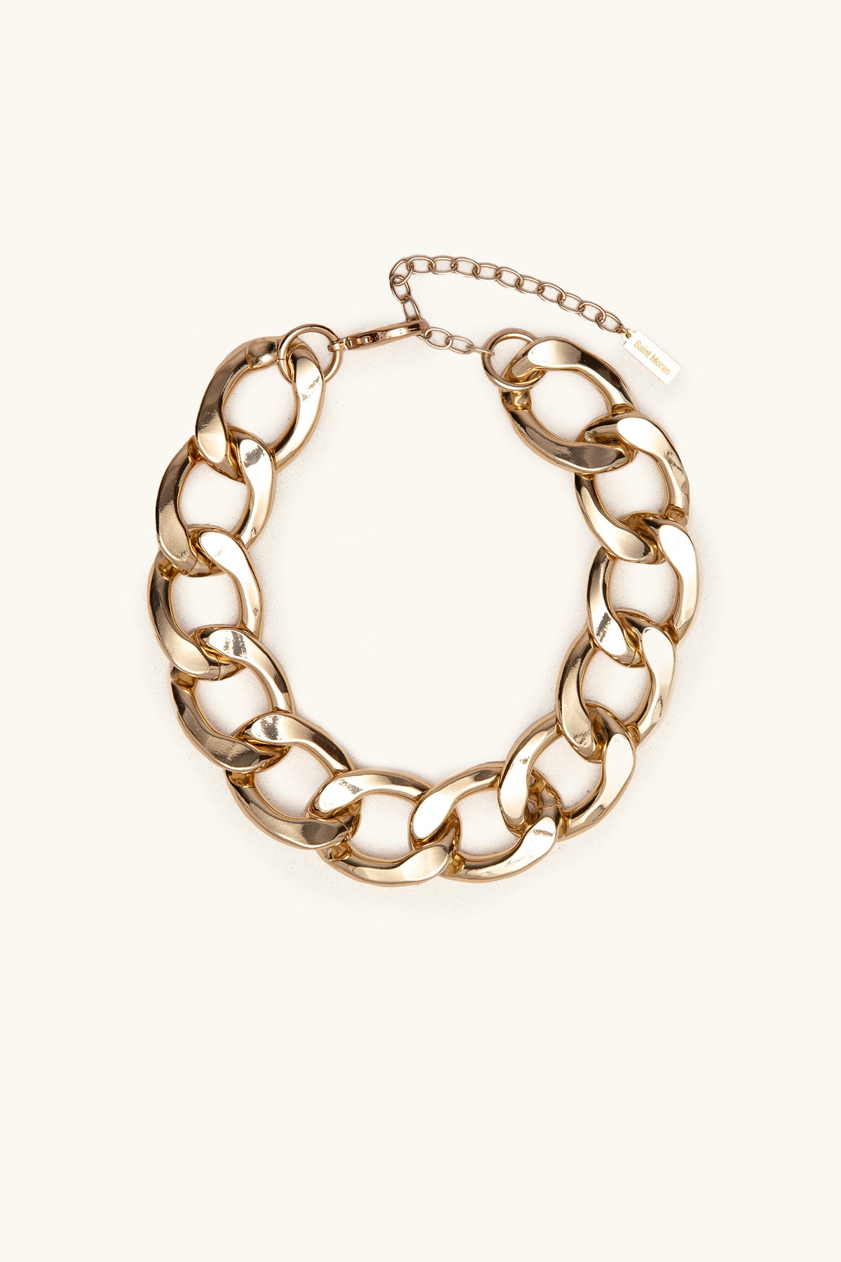 The Azlin Chain Necklace features chunky gold oval links and an adjustable clasp, shown on a plain light background.