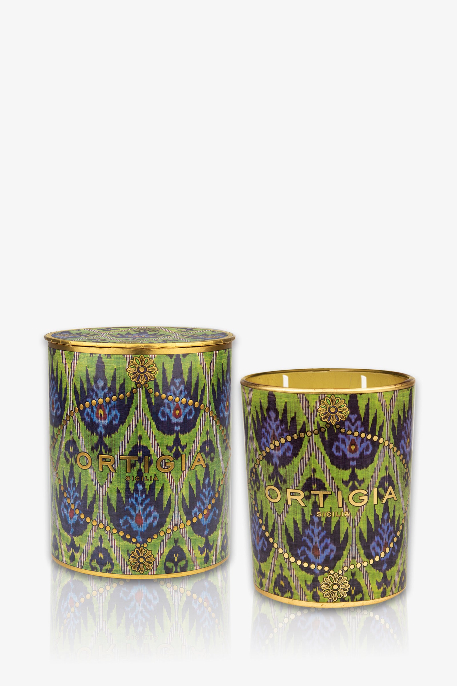 The Ortigia Bergamot Medium Candle features a decorative green geometric pattern and "Ortigia" branding. One candle is lidded, the other open—both add stylish elegance to your space.