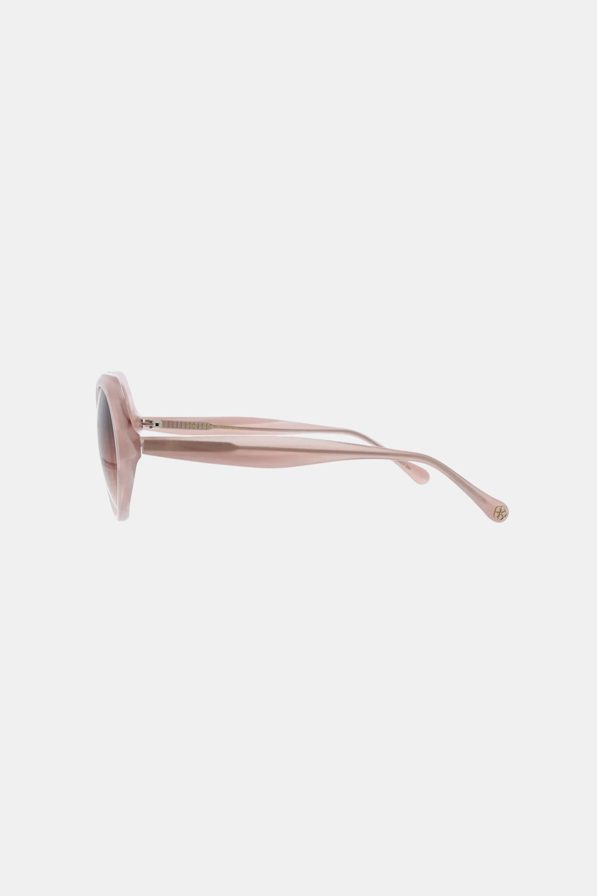 Side view of Sandcut Sunglass featuring pink, round frames, tinted lenses, and thick arms on a plain white background.