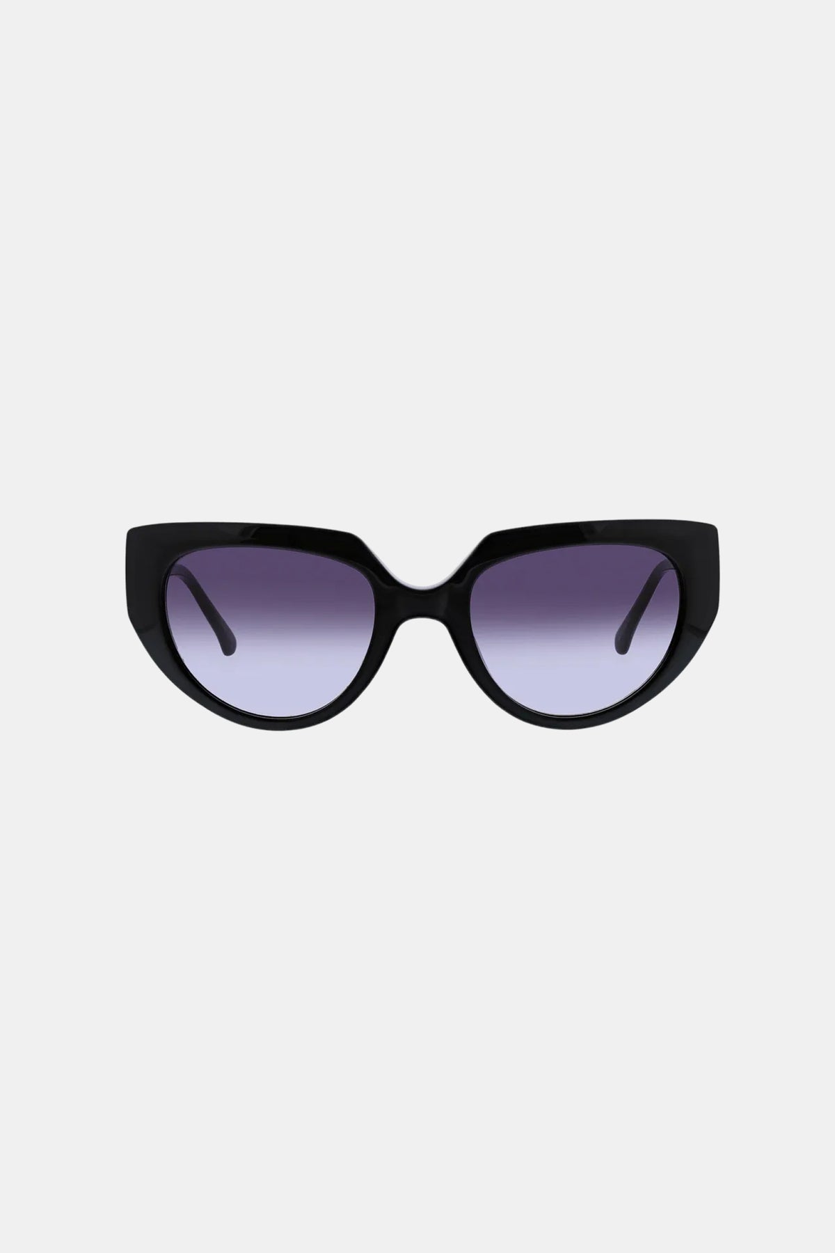 The Schooner Sunglass features black cat-eye frames with thick edges and gradient purple lenses, showcased on a plain light gray background.
