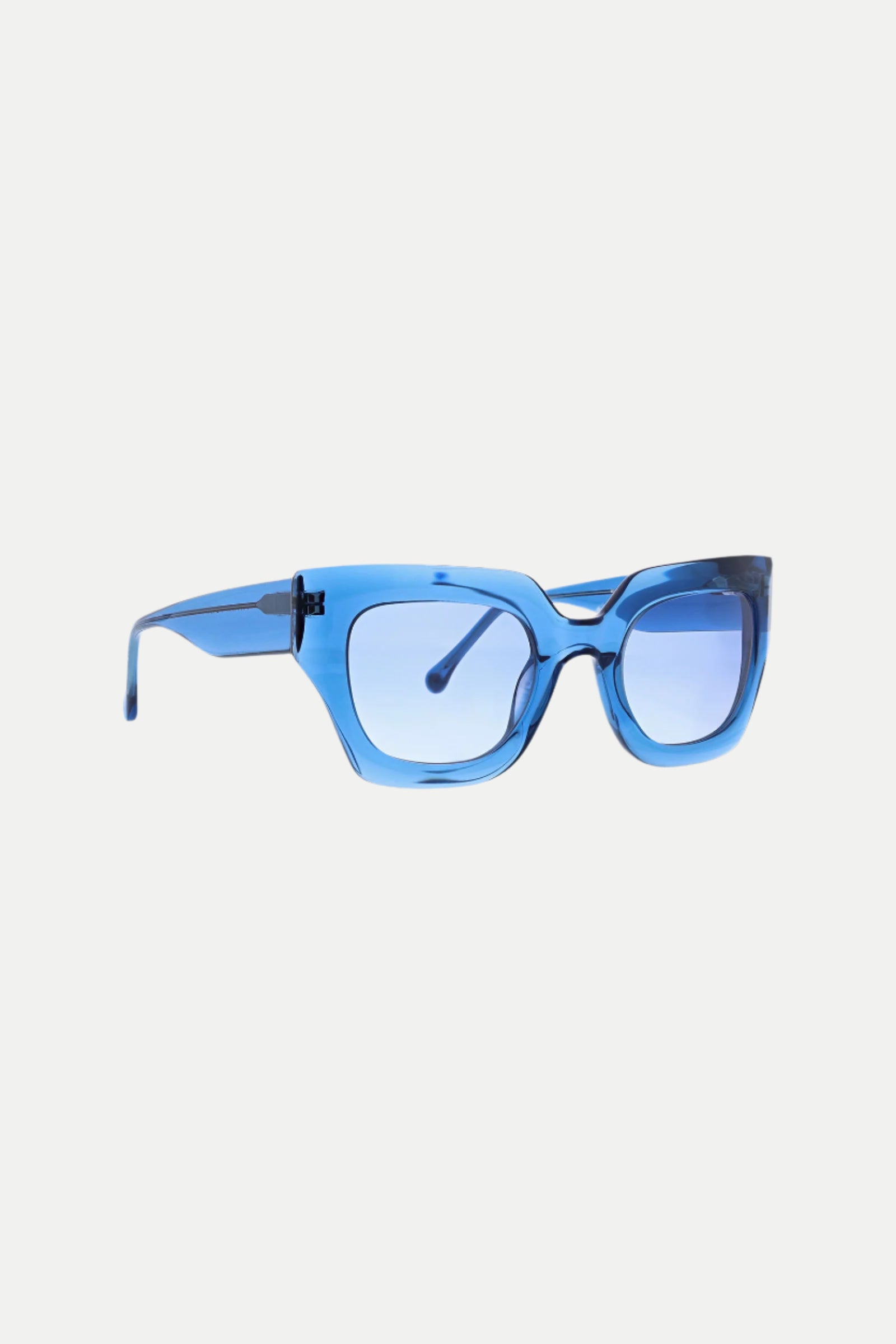 Sol Wide Frame Square Acetate Sunglasses featuring blue, thick transparent frames and matching blue-tinted lenses are shown on a white background.