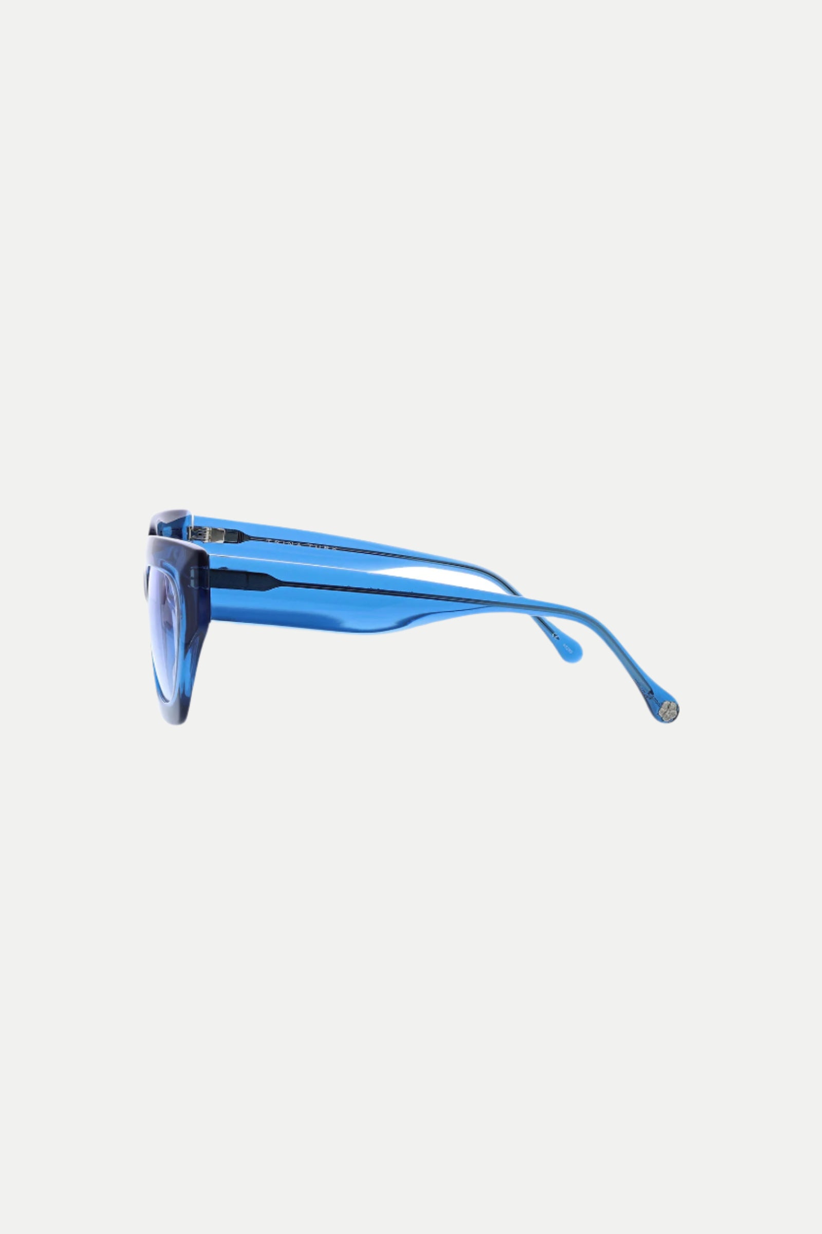 Side view of Sol Wide Frame Square Acetate Sunglasses in translucent blue with thick frames and slightly curved arms, displayed against a plain white background.