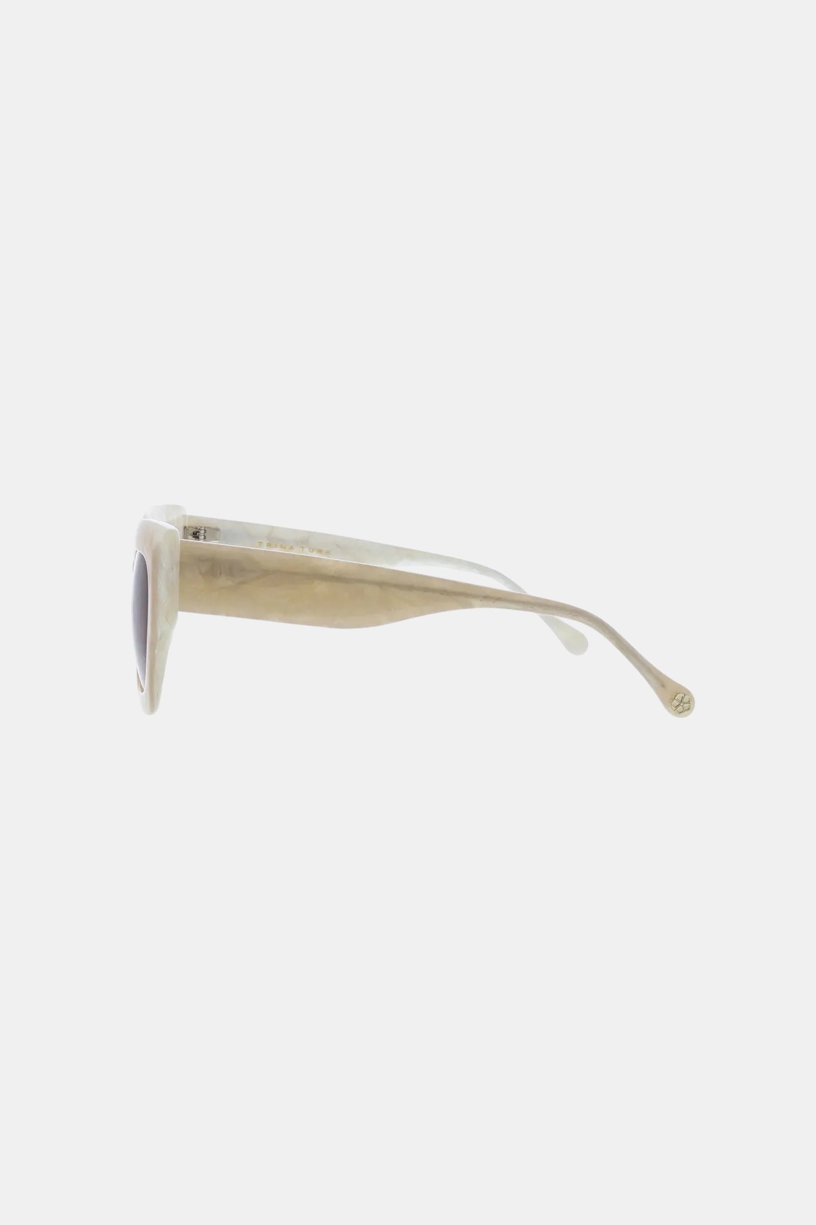 Side view of Sol Sunglass featuring thick, beige translucent frames and dark lenses, displayed against a plain white background.