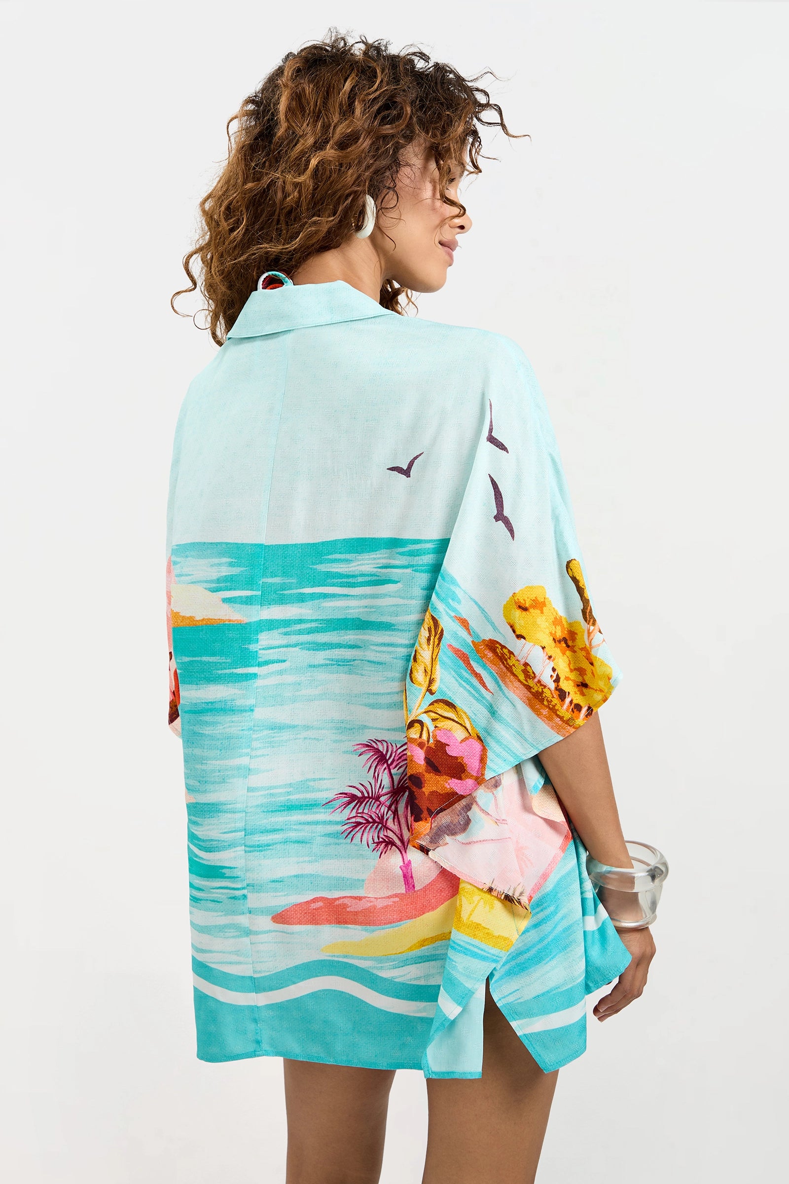 Of course! Please provide the keywords you'd like me to use for the Cover-Up Tunic - Cyclades.