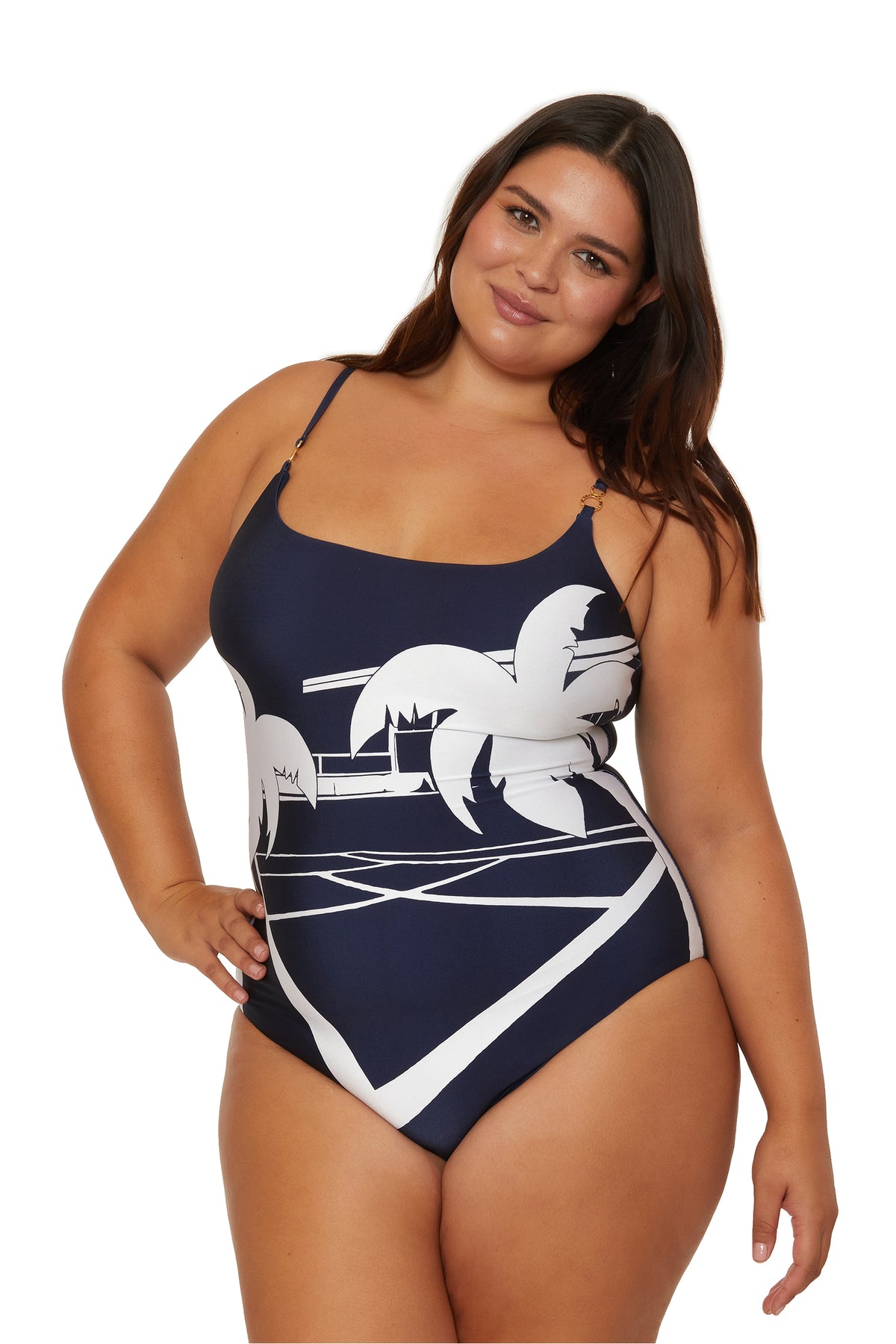 A woman smiles confidently with one hand on her hip, modeling the Scoop Neck One-Piece Swimsuit - Trina Tennis against a white background.