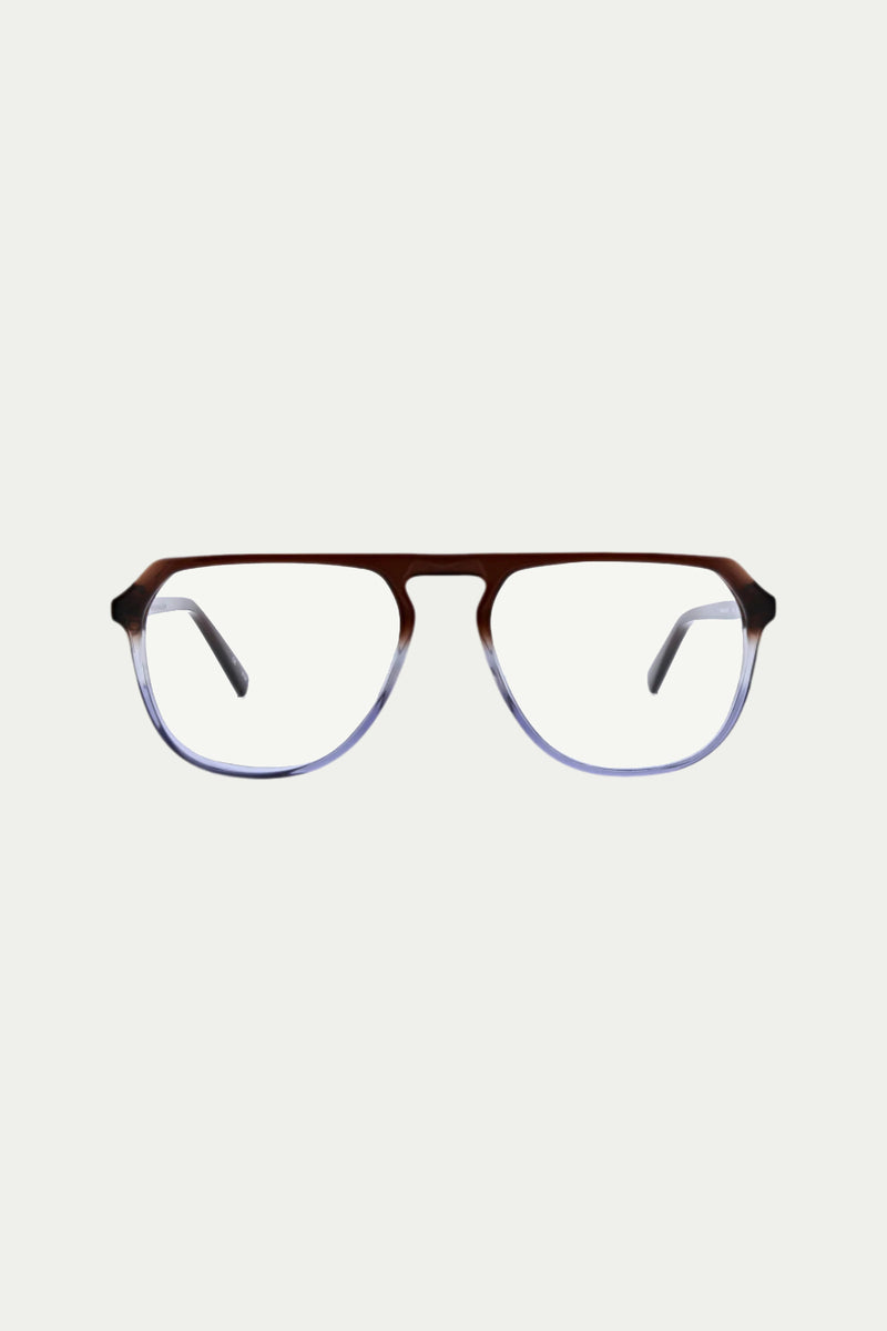 The Alvaro Optical Eyewear features a rectangular frame in indigo acetate, fading to clear at the bottom, with black temple arms and prescription lenses, displayed against a plain white background.