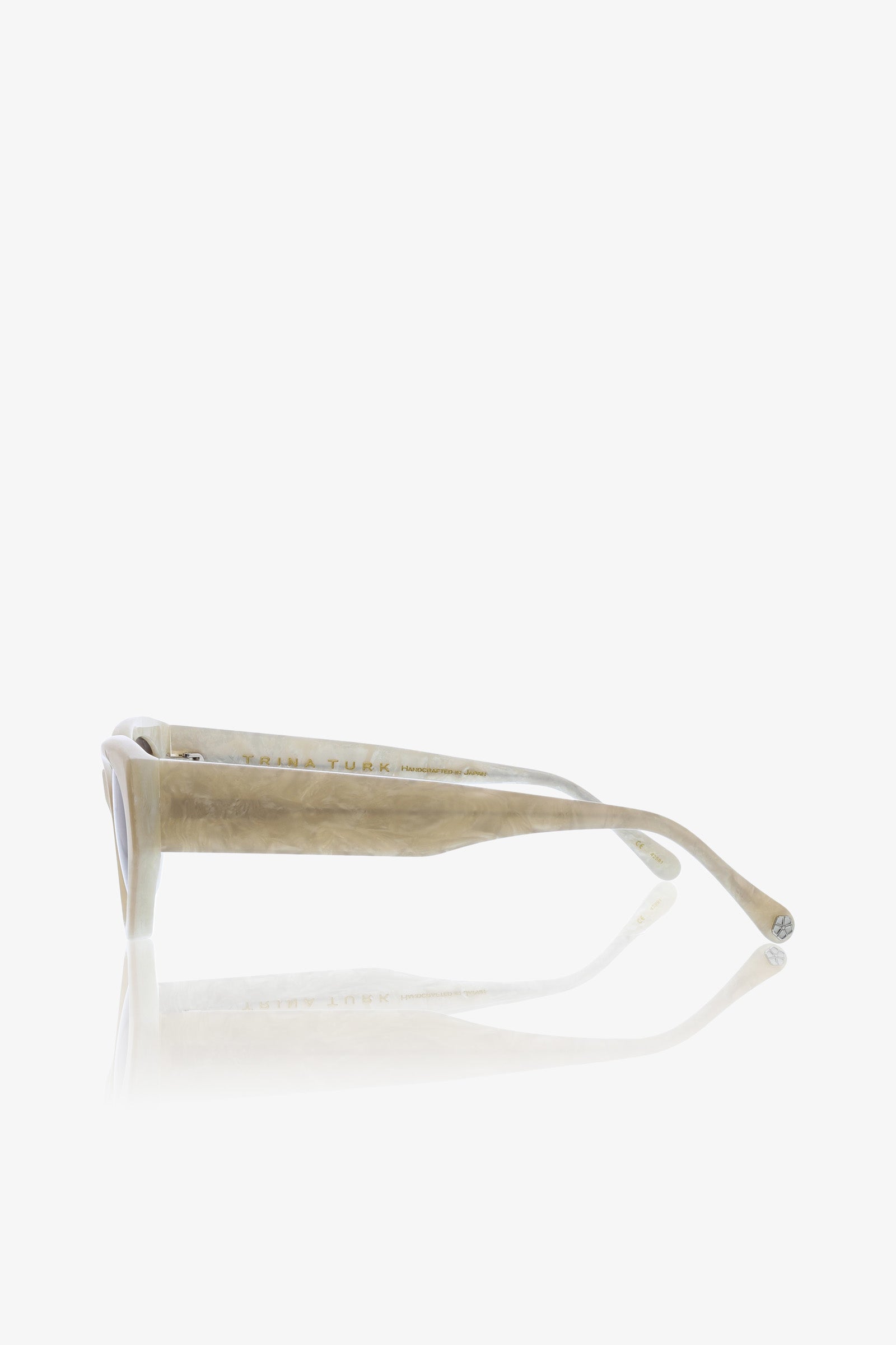 The Boulders Sunglass is showcased from the side against a white background, featuring thick beige or light brown frames that highlight the arm and hinge details.