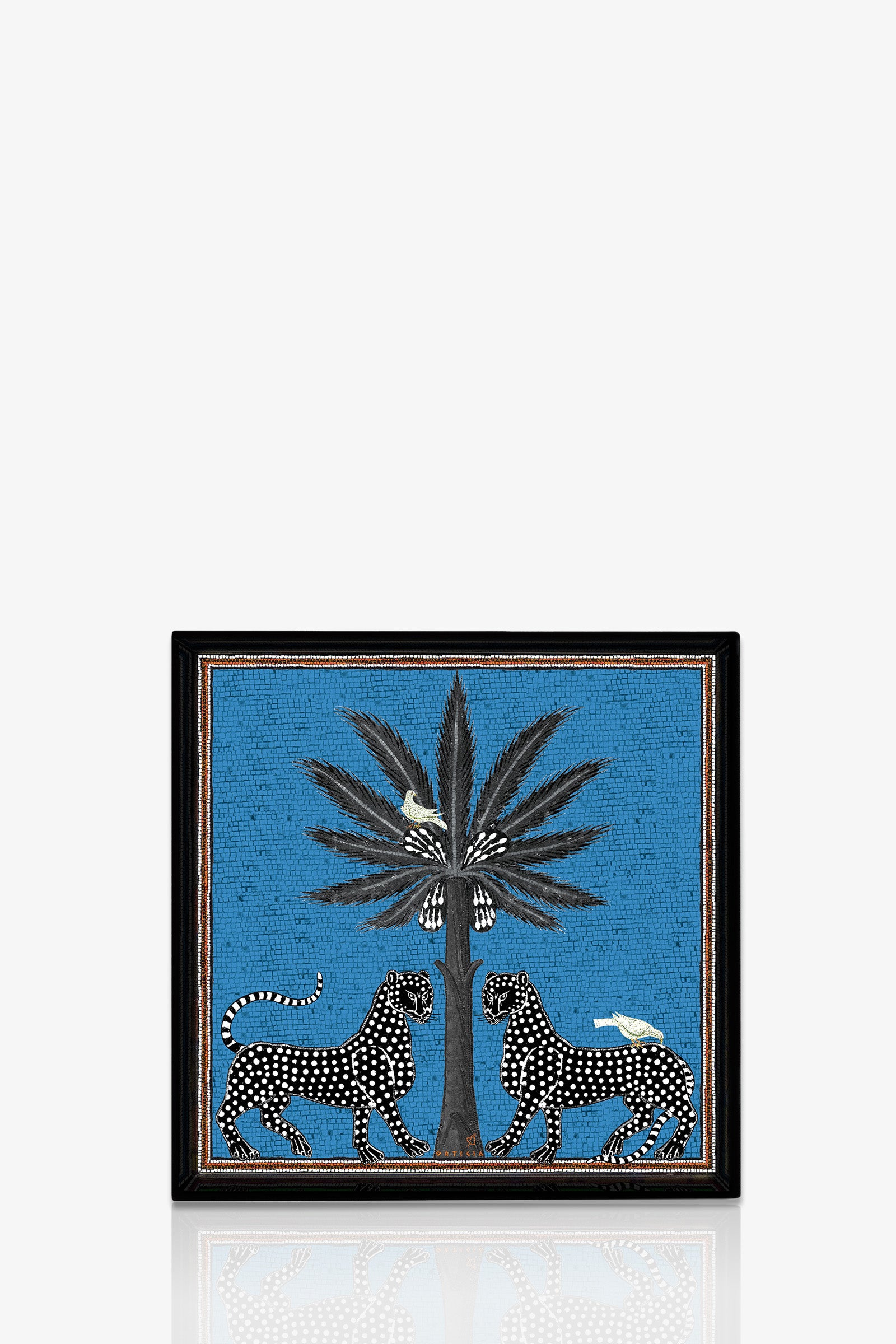 The Ortigia Square Tray features two black-and-white spotted leopards facing a tall, leafy plant on a bright blue background, with two white birds perched on the plant and one on a leopard’s back.