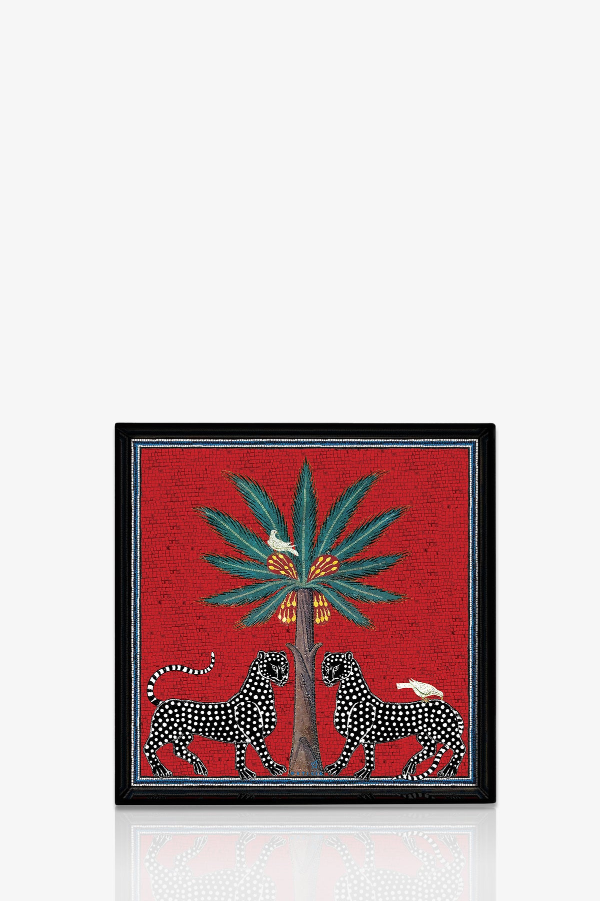 The Ortigia Square Tray features two black panthers with white spots facing each other beneath a palm tree, with white birds perched on their backs, all set against a bold red background.