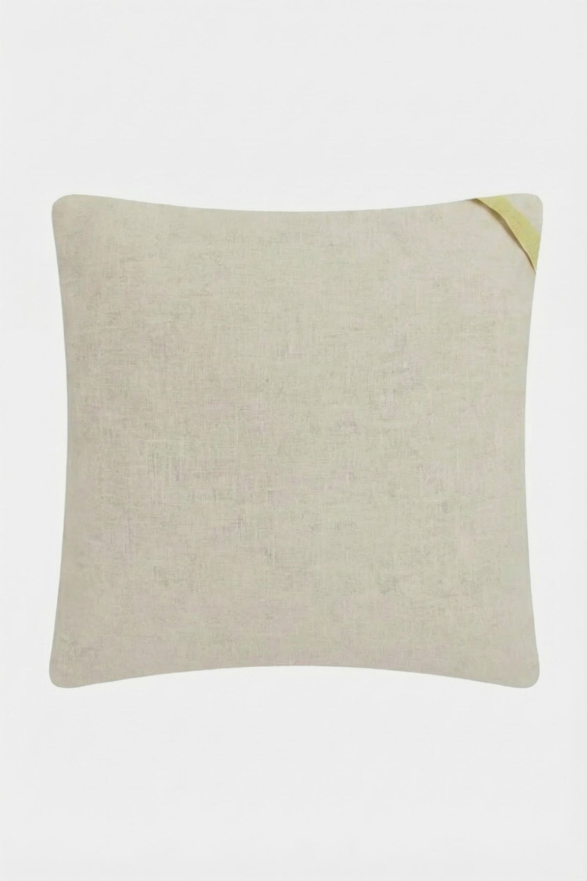 The Costa Mesa Embroidered Throw Pillow is square, light beige with a subtle texture, featuring a small yellow fabric loop on the top right corner, displayed against a plain white background.