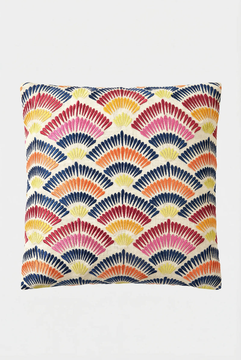 The Pasadena Embroidered Throw Pillow features a vibrant, geometric fan-shaped pattern in red, yellow, orange, and navy blue on a white background.