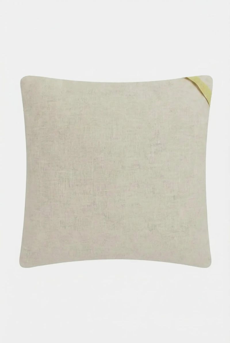 The Pasadena Embroidered Throw Pillow is a square, light beige cushion with subtle textured fabric and a small yellow fabric loop on the top right corner, shown against a plain white background.