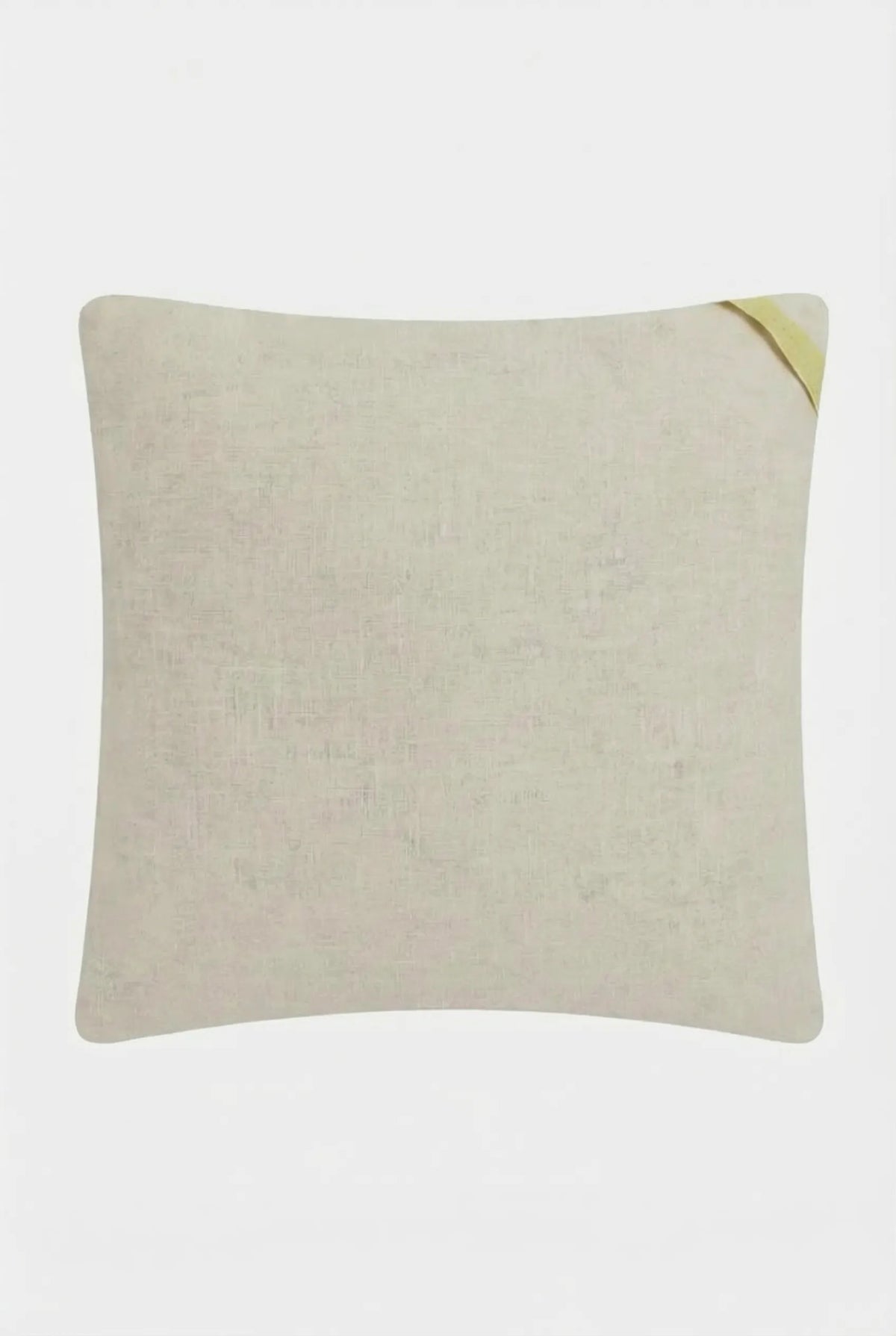 The Pasadena Embroidered Throw Pillow is a plain, square beige cushion with a small diagonal yellow fabric tag on the top right corner, displayed against a white background.