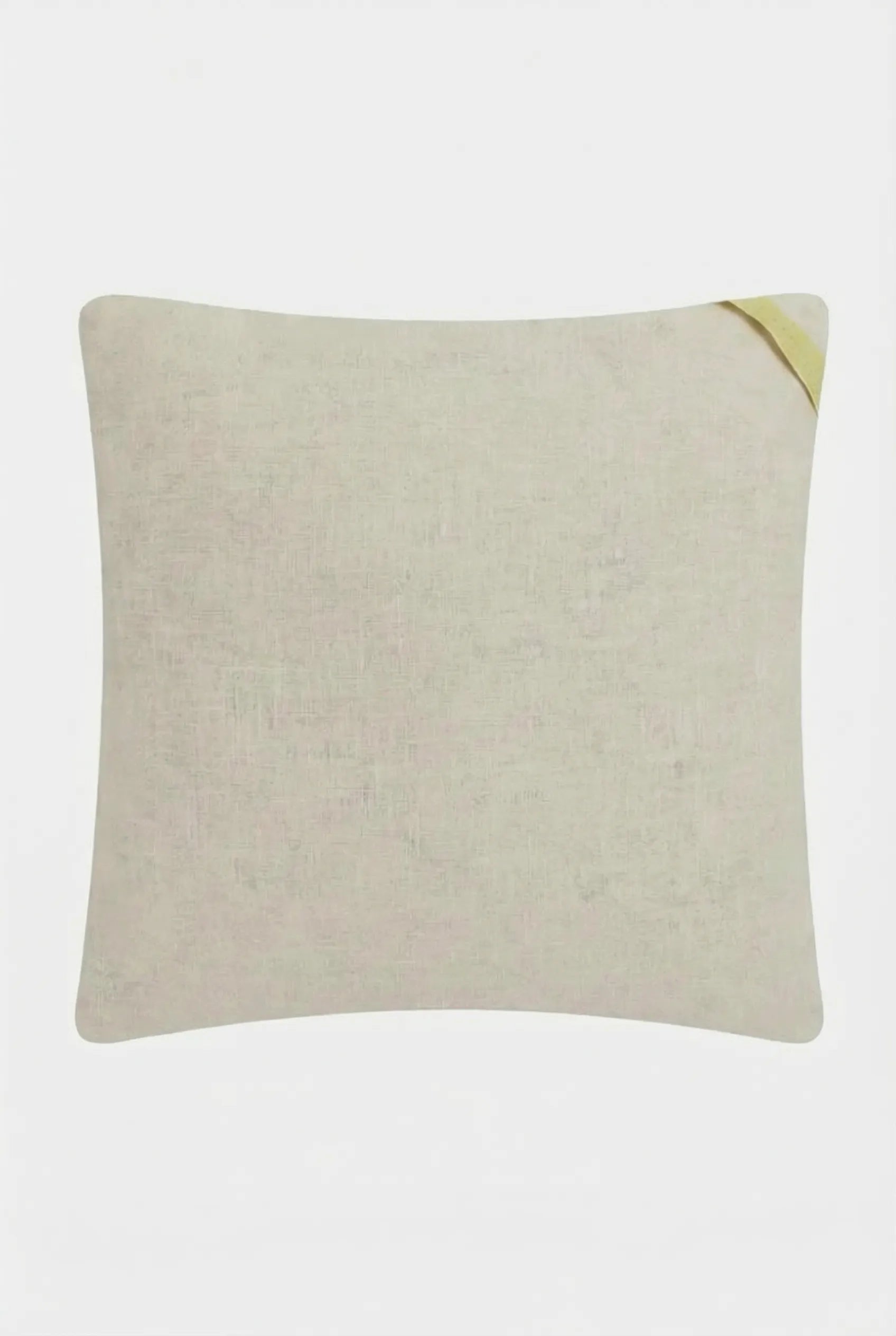 The Pasadena Embroidered Throw Pillow is a plain, square beige cushion with a small diagonal yellow fabric tag on the top right corner, displayed against a white background.