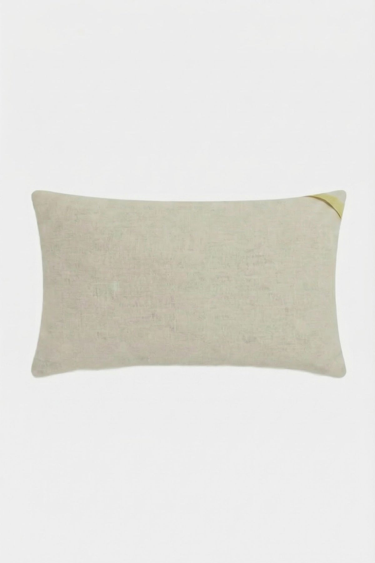 The Roseville Embroidered Lumbar Pillow is a rectangular beige pillow with a subtle texture, shown with a small corner fold at the top right on a plain white background.
