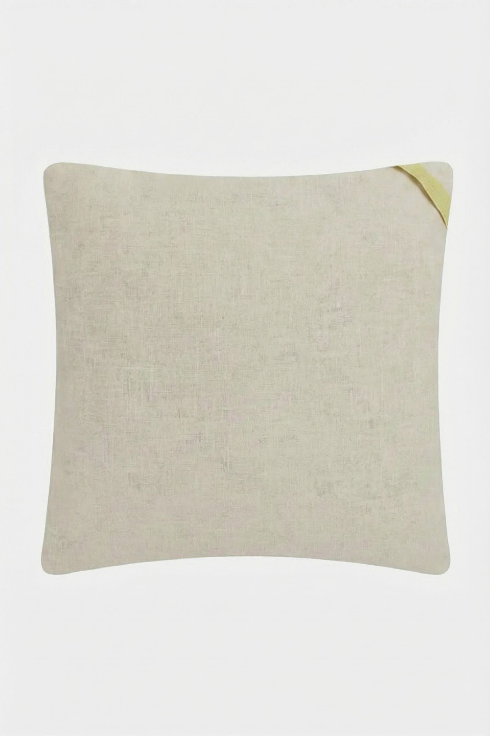 The Shanghai Links Embroidered Throw Pillow is a light beige square cushion with subtle texture and a small yellow fabric loop at one corner, shown against a white background.