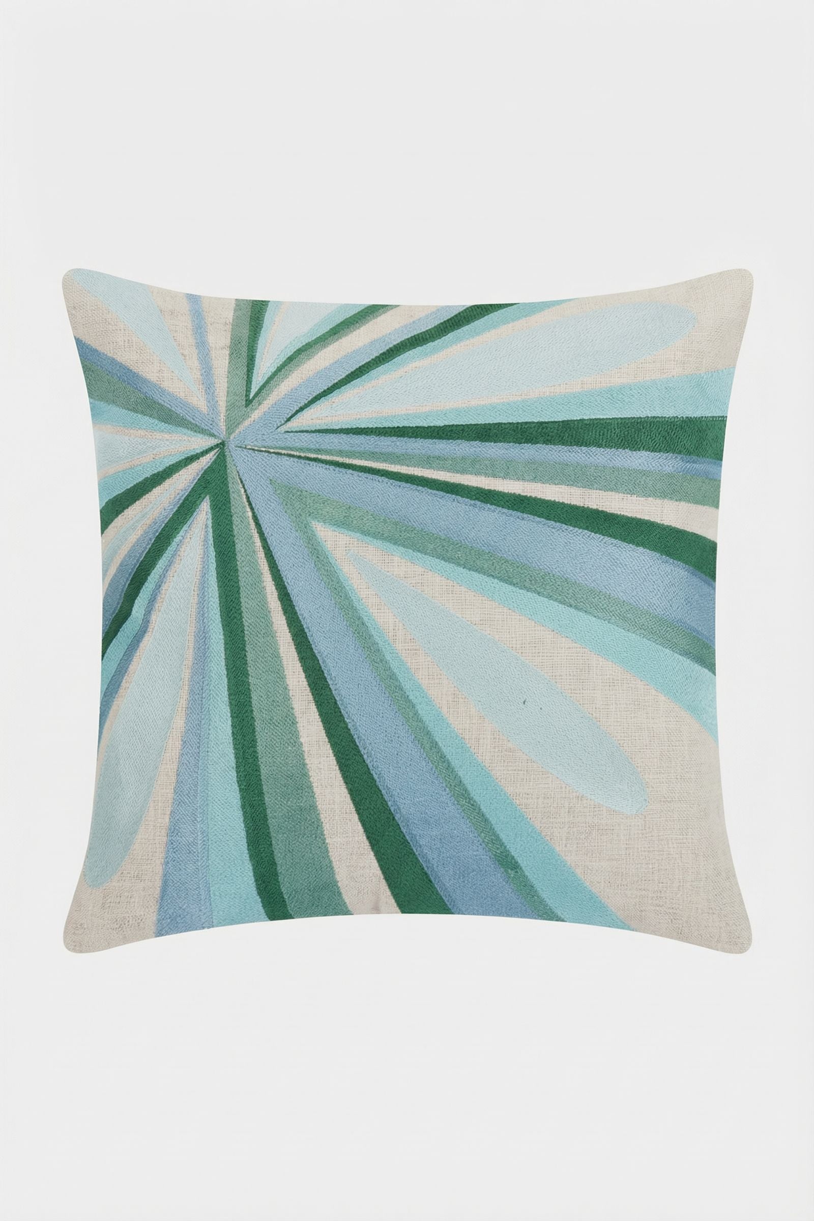 The Shante Embroidered Pillow features an abstract design with overlapping green, blue, and teal lines radiating from one corner on a light beige background, creating a dynamic effect.