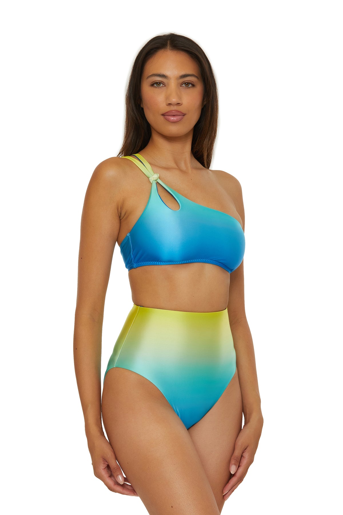 A woman wears the One Shoulder Swim Top - West Palm, featuring a blue-to-green gradient and cutout by the strap, standing against a white background.