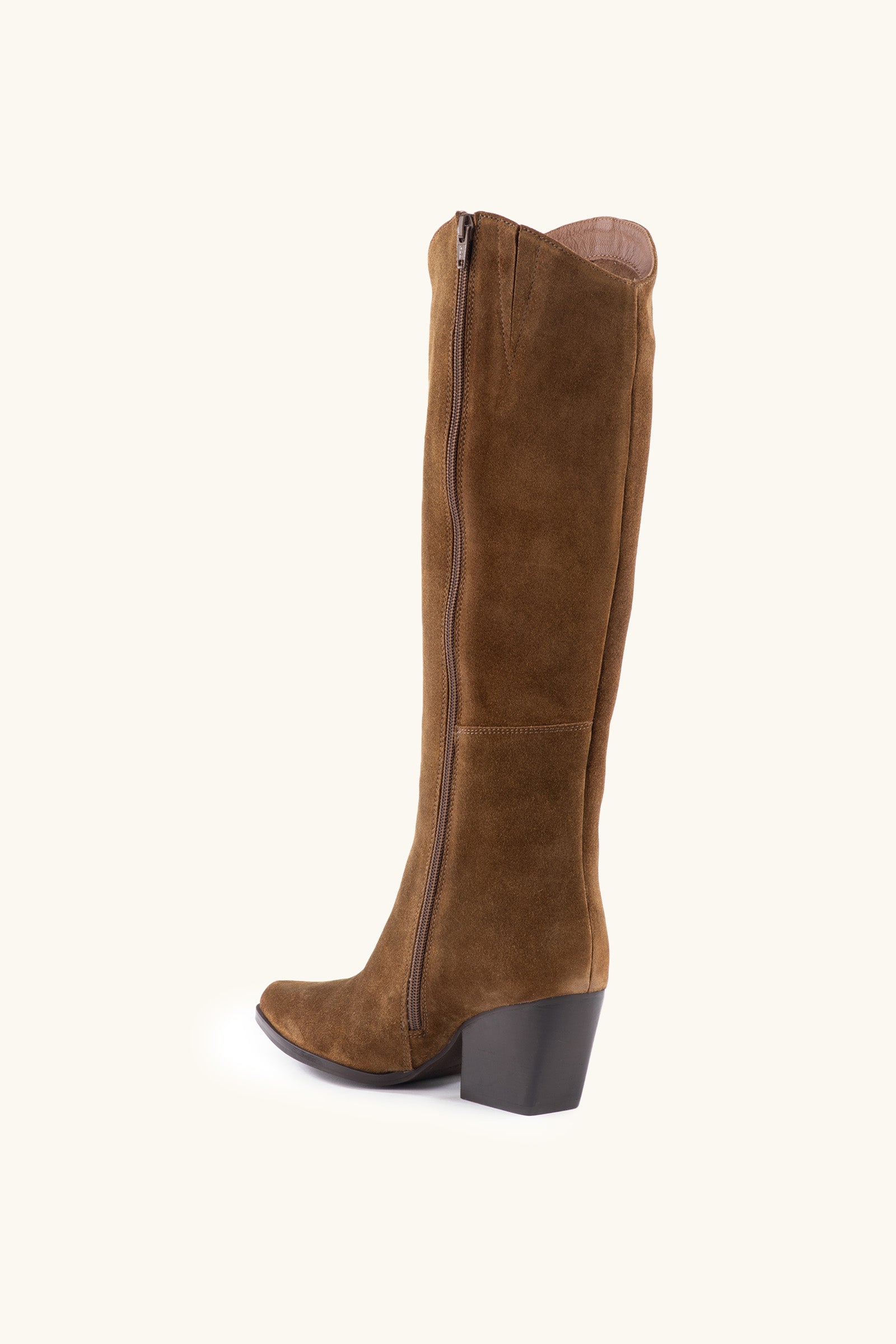 The Begging You Tall Brown Suede Boot With Pointed Toe features a side zipper, chunky mid-height stacked block heel, and is shown in rich brown suede on a neutral background.