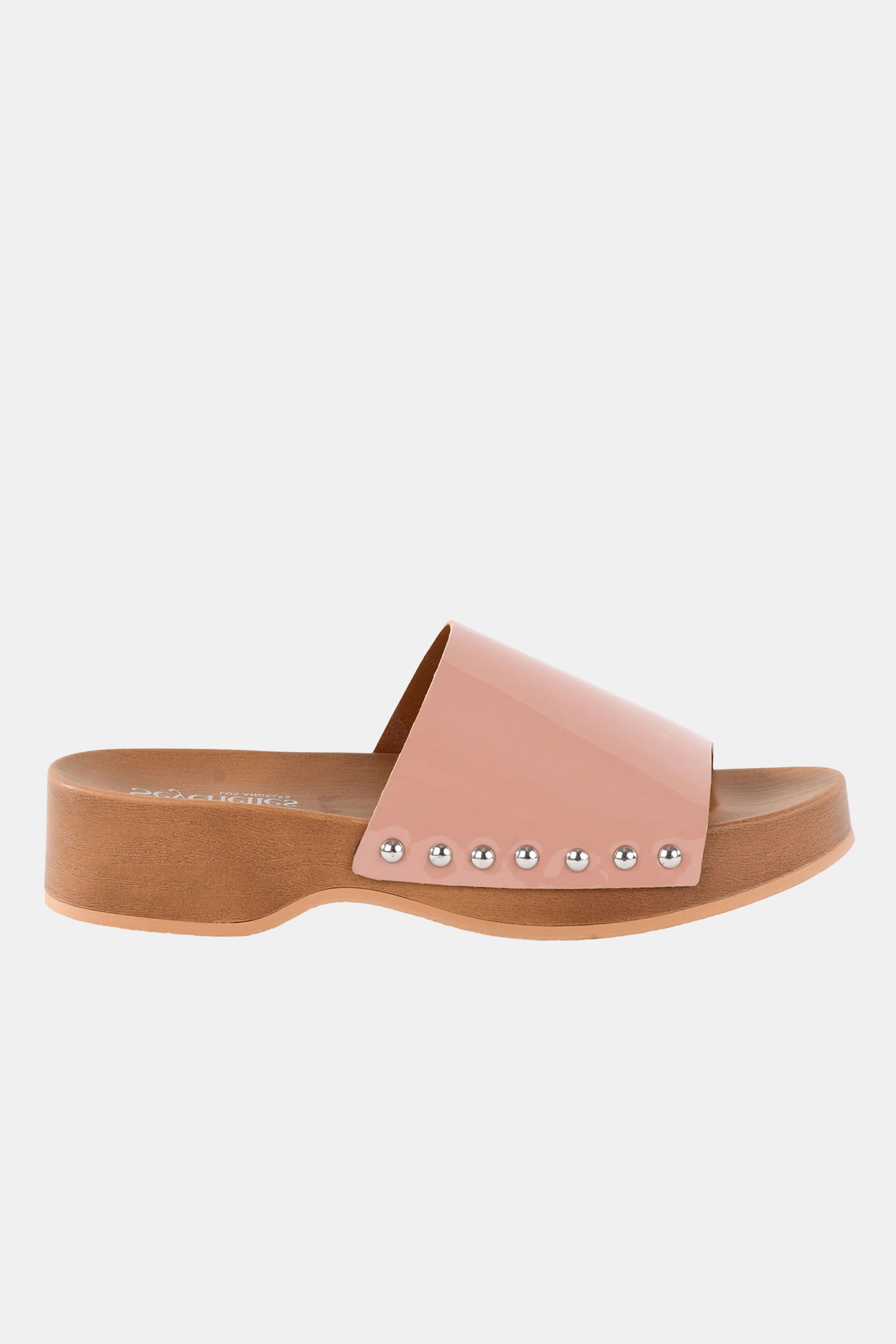 The Seychelles Fantasy Patnt Slide is a pink slide sandal with a wide shiny strap, silver studs, and a low tan platform heel, shown in side view on a white background.