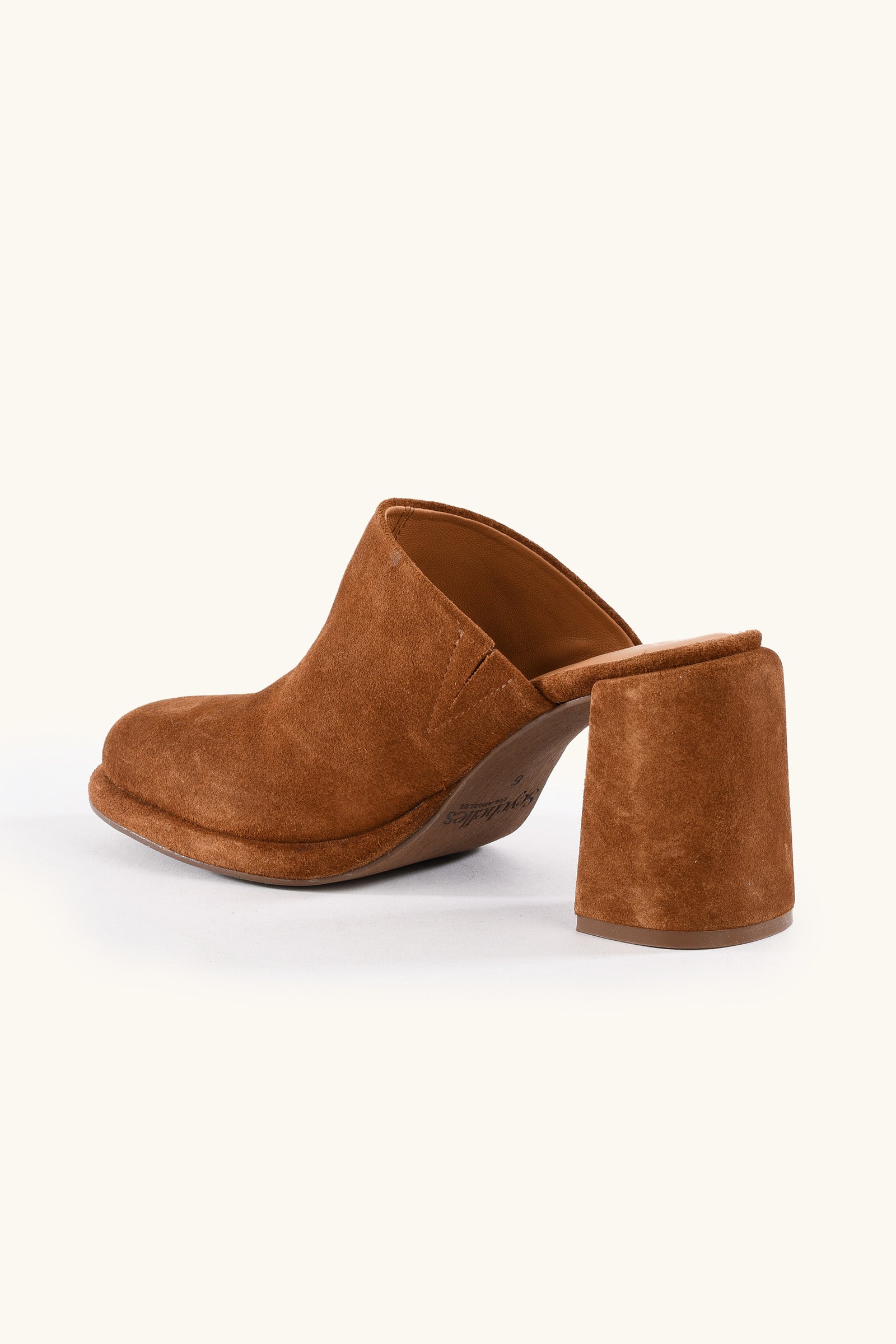The Honor Mule - Brown Suede is a mule-style shoe with a chunky, angled heel, shown in side view against a plain light background.