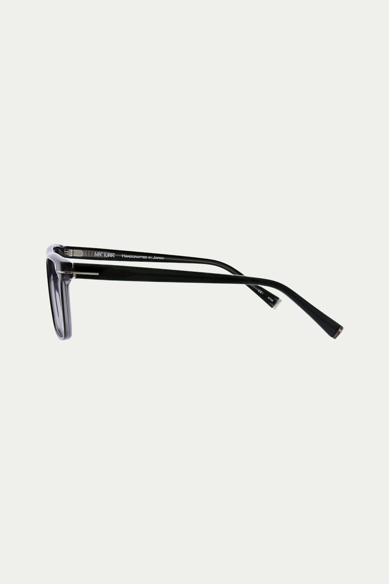 Side view of Jacobsen Optical Eyewear featuring a black metal frame, thin straight arms, and rectangular lenses, set against a plain white background.