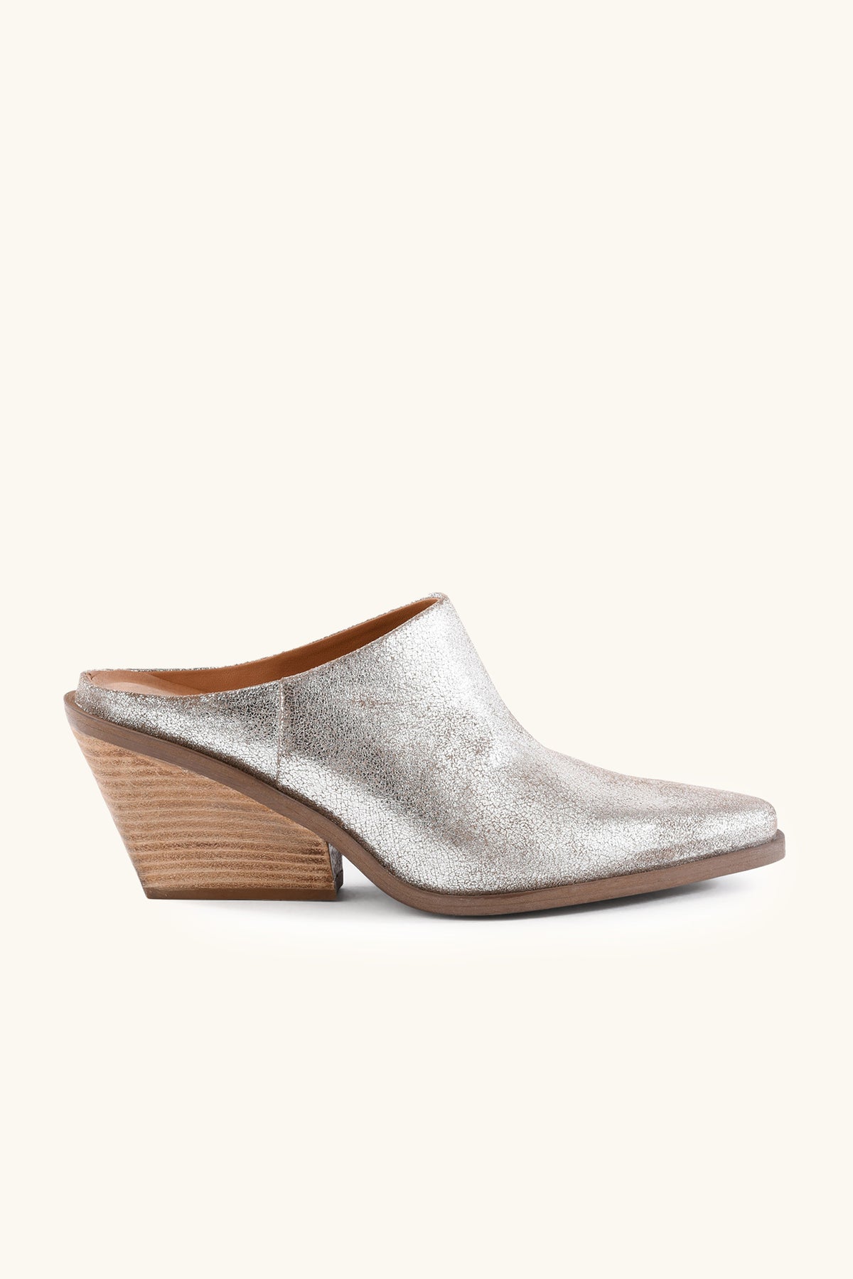 The Seychelles Morning Joe Mule features a metallic silver finish, pointed toe, and medium-height angled wooden block heel, displayed in a side view on a plain light background.