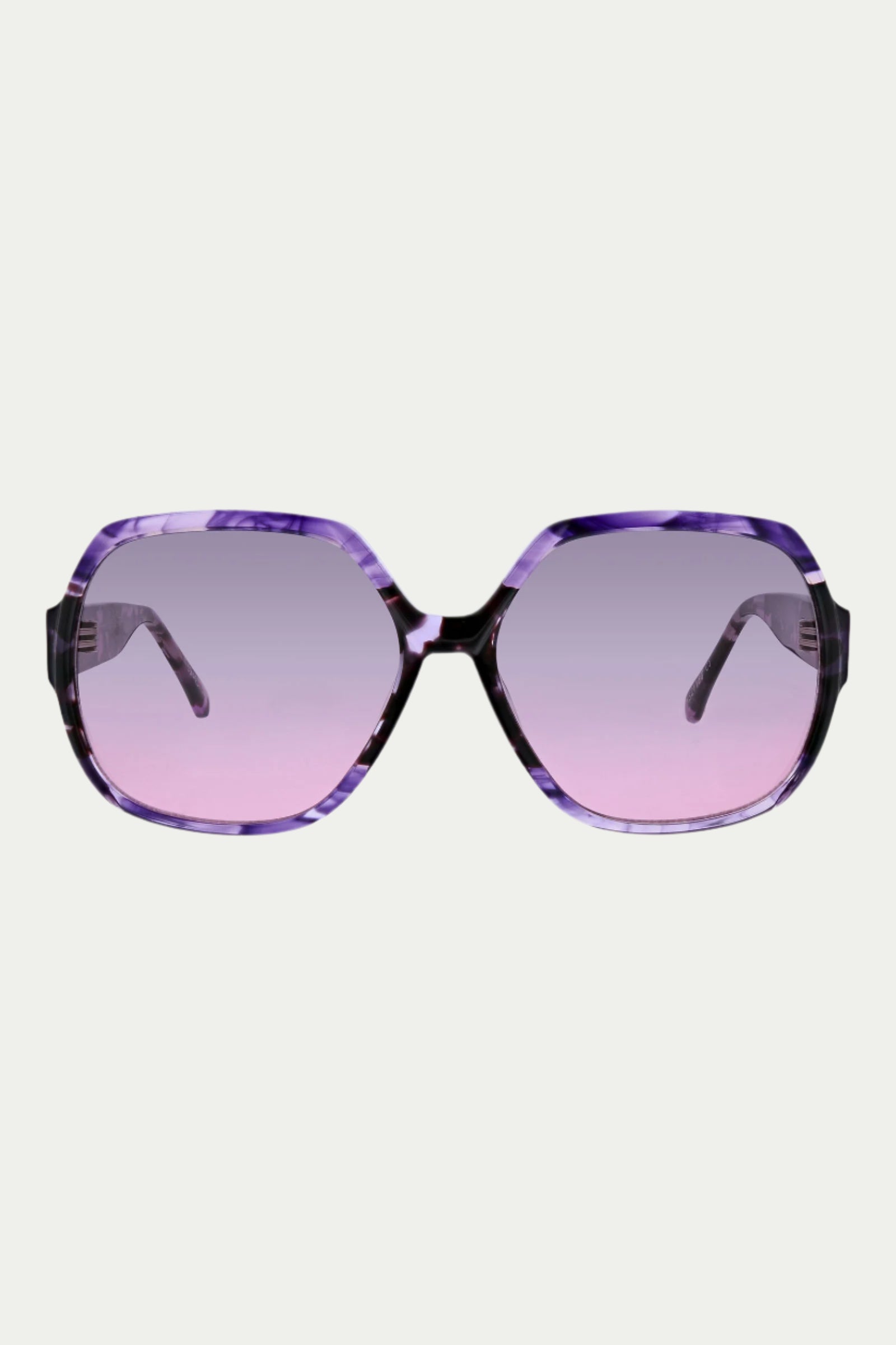 The Tresco Sunglass features oversized square purple frames and large geometric gradient lenses in a pinkish-purple tint, offering 100% UVA/UVB protection, shown against a plain white background.